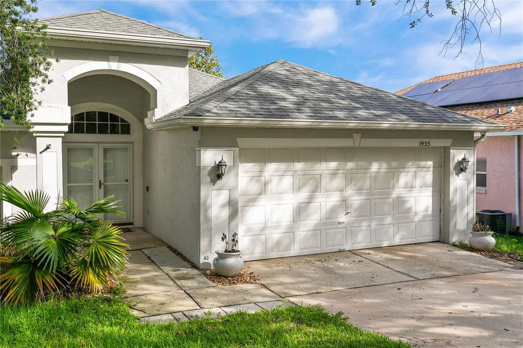 Photo of 1935 Westpointe Circle, Orlando, FL 32835 (MLS # O6418860)