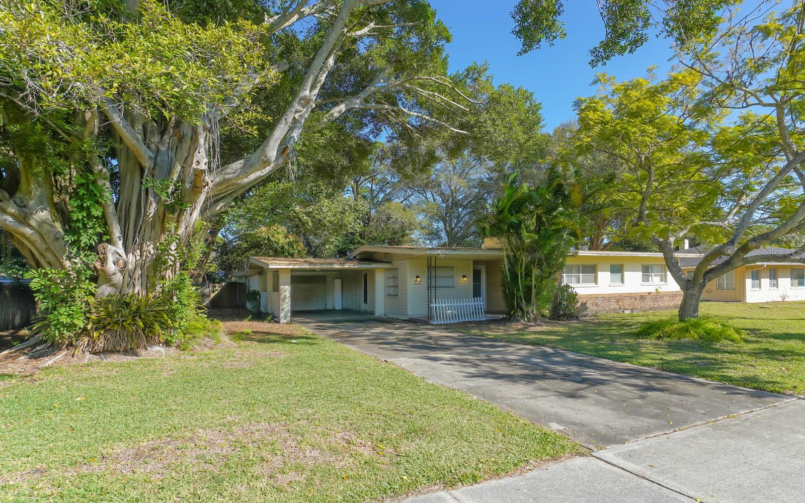 Unlock the potential of this ideally situated property on Ringling Boulevard—just minutes from downtown Sarasota, the Marina, and Gulf beaches. Whether you're planning a full-scale renovation or a complete teardown for new development, this 2-bedroom, 2-bath home offers solid value in a rapidly evolving corridor. Featuring an open floor plan, carport, workshop area, and a sunlit Florida room, the existing structure provides flexibility for updates. Yet, the true opportunity lies in the land, positioned along the prominent Ringling Blvd. with redevelopment momentum.