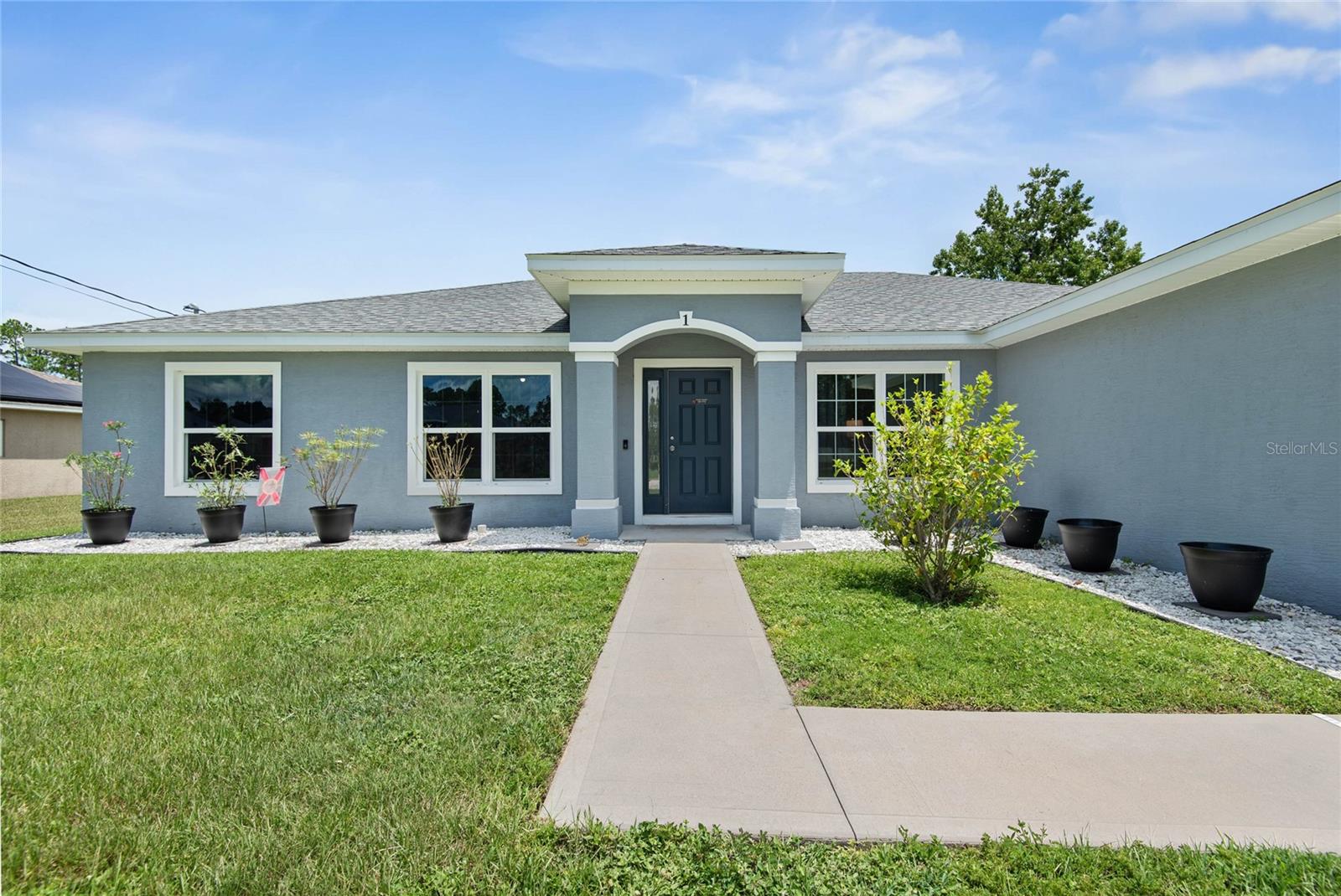 Welcome to this spacious and thoughtfully designed Willow model by Seagate Homes, located on a quiet cul-de-sac in the desirable Quail Hollow neighborhood of Palm Coast, Florida. Built in 2021 and offering over 2,200 square feet of living space, this 4-bedroom, 2-bathroom home sits on a generous ¼-acre lot with minimal traffic — ideal for families, investors, or anyone seeking comfort and convenience on Florida’s east coast. Step inside to an open floor plan that blends style and functionality. A formal dining area, breakfast nook, and a large kitchen island make entertaining easy, while stainless steel appliances and upgraded tinted windows promote energy efficiency and year-round comfort. The screened concrete back patio offers the perfect outdoor retreat for morning coffee or evening relaxation. Nestled just 10 minutes from Flagler Beach, you’ll enjoy proximity to shopping centers, local coffee shops, and Palm Coast Town Center, plus quick access to US-1 and major highways. Residents also have access to the newly developed Southern Recreation Center, featuring pickleball and tennis courts, walking trails, and more. Whether you're starting a family, expanding your investment portfolio, or looking to enjoy everything Palm Coast has to offer, this move-in-ready home is the perfect fit. Don’t miss out — schedule your private tour today!