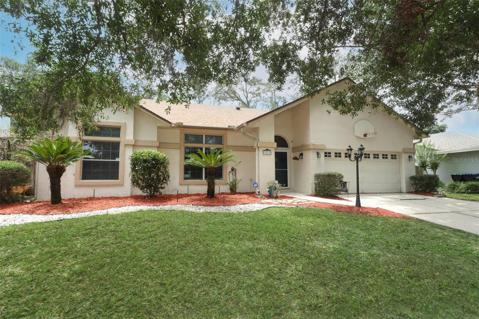 Introducing 3236 Paisley Circle, a stunning residential gem located just minutes from the University of Central Florida. This immaculate property offers a harmonious blend of comfort, style, and modern elegance. Buy with confidence as this home's ROOF WAS REPLACED in 2020. With its prime location and exceptional features, this home presents a remarkable opportunity for those seeking the perfect place to settle down or a great investment property opportunity. Located in Berkshire Place, this residence boasts a charming curb appeal with its well-maintained landscaping, and attractive exterior. Stepping inside, you'll be greeted by a spacious and open floor plan designed to maximize both functionality and aesthetics. The interiors are adorned with high-quality finishes, contemporary fixtures, and abundant natural light that creates an inviting atmosphere throughout. The home features 4 bedrooms and 2 bathrooms, providing ample space for relaxation and privacy. The master suite is a true retreat, offering a peaceful sanctuary with its generous size, wood floors, and an en-suite bathroom complete with a luxurious soaking tub and separate shower. The additional bedrooms are equally comfortable, providing cozy havens for family members or guests. The heart of the home lies in the gourmet kitchen, which is sure to impress even the most discerning chefs. Equipped with sleek cabinetry, a spacious island, and granite countertops, this kitchen is a culinary enthusiast's dream come true. Whether you're hosting intimate gatherings or preparing everyday meals, this space is designed to make cooking a delight. The living areas are thoughtfully designed to create a seamless flow, making entertaining a breeze. The living room offers a cozy fireplace, perfect for chilly evenings, while the dining area provides an elegant setting for hosting formal dinners or casual get-togethers. Additionally, the home features a home office, a versatile space that can adapt to your specific needs. One of the highlights of this property is the well-manicured backyard, which provides a serene outdoor oasis for relaxation and recreation. Whether you envision hosting lively barbecues or enjoying quiet evenings under the stars, the patio space is perfect for creating lasting memories with family and friends. 3236 Paisley Circle is an exceptional residence that presents an unparalleled opportunity to own a stylish and comfortable home in the heart of Orlando. With its desirable location, impeccable design, and luxurious features, this property is truly a dream come true. Don't miss your chance to experience the best of Florida living in this remarkable home. Schedule a showing today and envision the possibilities that await you.
