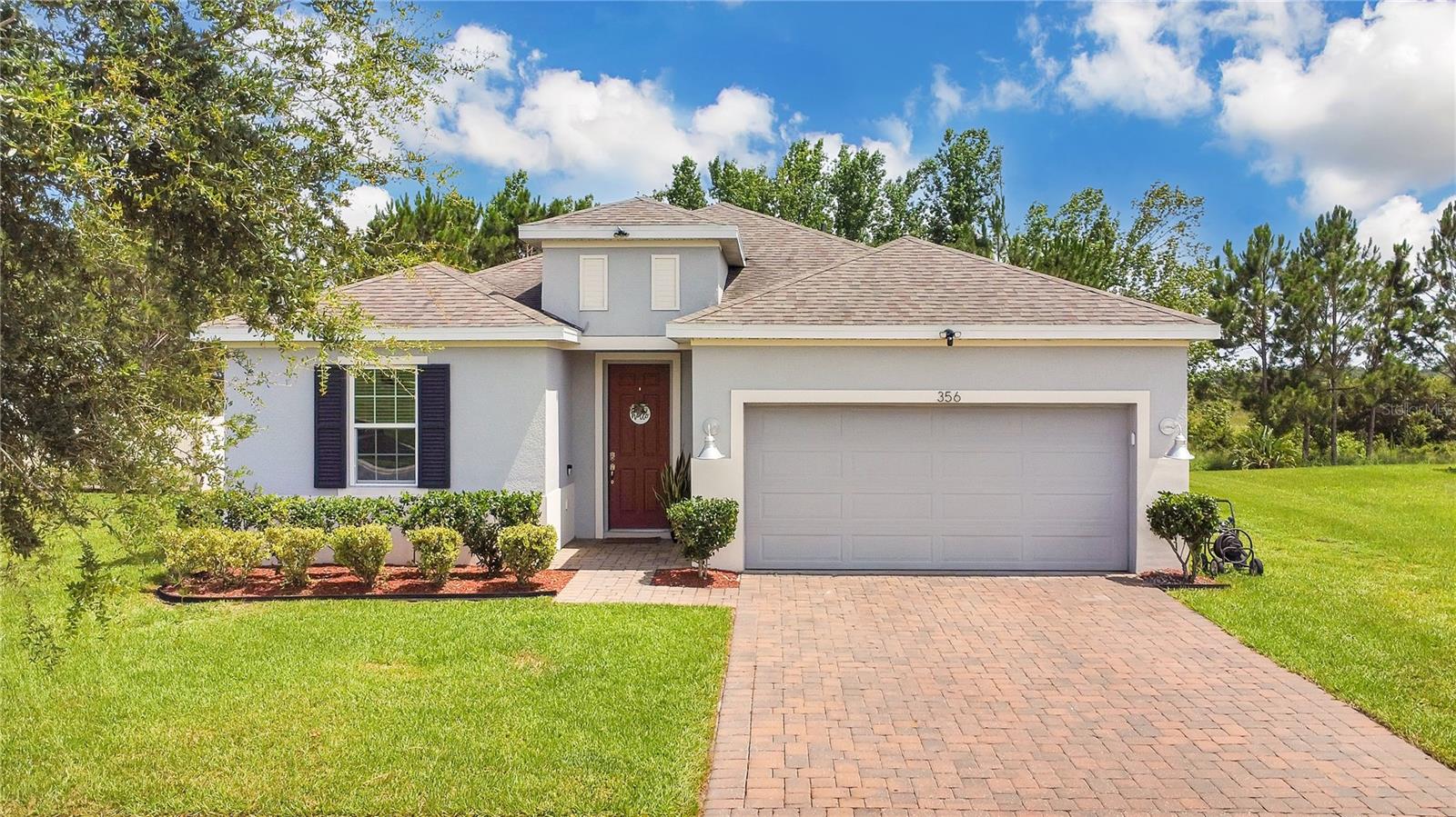Welcome to this beautifully maintained 4-bedroom, 2-bathroom single-family home nestled in the peaceful community of Groveland! Offering 1,863 sq ft of comfortable living space, this home boasts a bright and open floor plan perfect for both relaxing and entertaining. Step into a spacious kitchen featuring sleek quartz countertops, stainless steel appliances, and plenty of cabinetry for all your storage needs. The open-concept design flows seamlessly into the dining and living areas, creating a warm and inviting atmosphere. This is the only floorplan of its kind in the entire community. A rare find! It backs up to a serene conservation area and includes a screened-in lanai, perfect for enjoying the peaceful views and Florida breezes. Each of the four bedrooms offers ample space and natural light, while the two full bathrooms are stylish and functional. The primary suite provides a private retreat with a walk-in closet and ensuite bath. Located near parks, lakes, and everyday conveniences, this home is the perfect blend of comfort, nature, and Florida charm. Don’t miss your opportunity to own this unique gem!