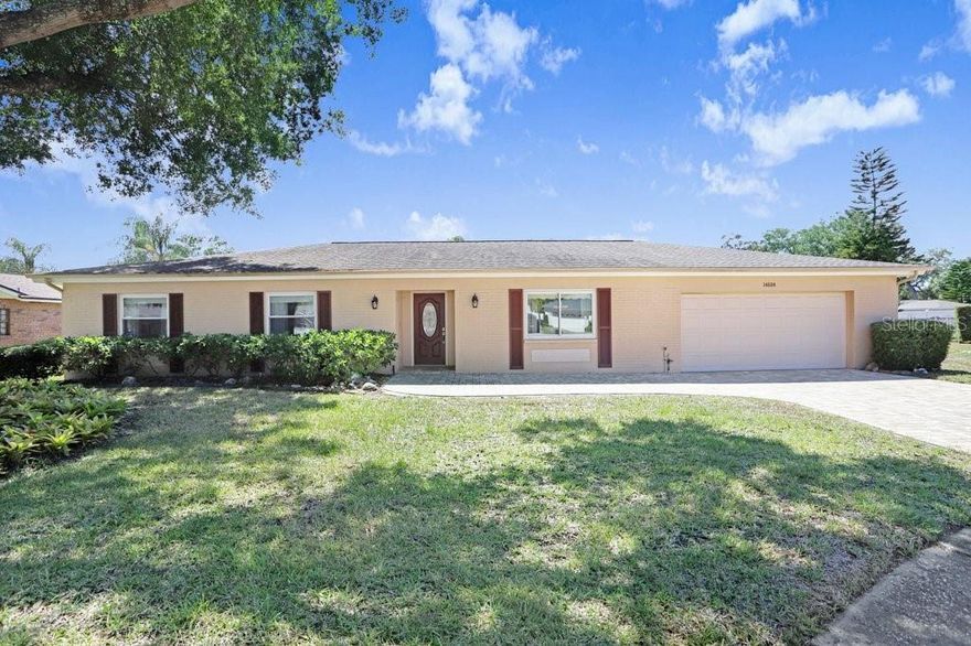 Welcome to this beautifully maintained 4-bedroom, 2-bath home nestled in the highly desirable Brentwood Hills community—one of Tampa’s most established and sought-after neighborhoods. Perfectly positioned on an oversized half-acre pie-shaped lot at the end of a quiet cul-de-sac, this property offers the ideal combination of privacy, charm, and space to truly enjoy Florida living.Step inside and fall in love with the updated kitchen featuring granite countertops, stainless steel appliances, and plenty of space for cooking and entertaining. Natural light pours throughout the home, creating a bright, warm, and inviting atmosphere in every room.Outside, your own tropical backyard retreat awaits. Surrounded by lush mature landscaping, this expansive yard offers endless possibilities—whether you envision relaxing evenings outdoors, entertaining guests, adding a pool, or creating the ultimate custom outdoor oasis.Major updates include a roof approximately 10 years old and an A/C system only 6 years old, providing peace of mind for years to come.Conveniently located near shopping, dining, top-rated schools, and major highways including I-275 and the Veterans Expressway, this home also offers easy access to Tampa International Airport, Downtown Tampa, and the beautiful Gulf beaches.  Opportunities like this are rare in Brentwood Hills—schedule your private showing today and experience everything this exceptional home has to offer!