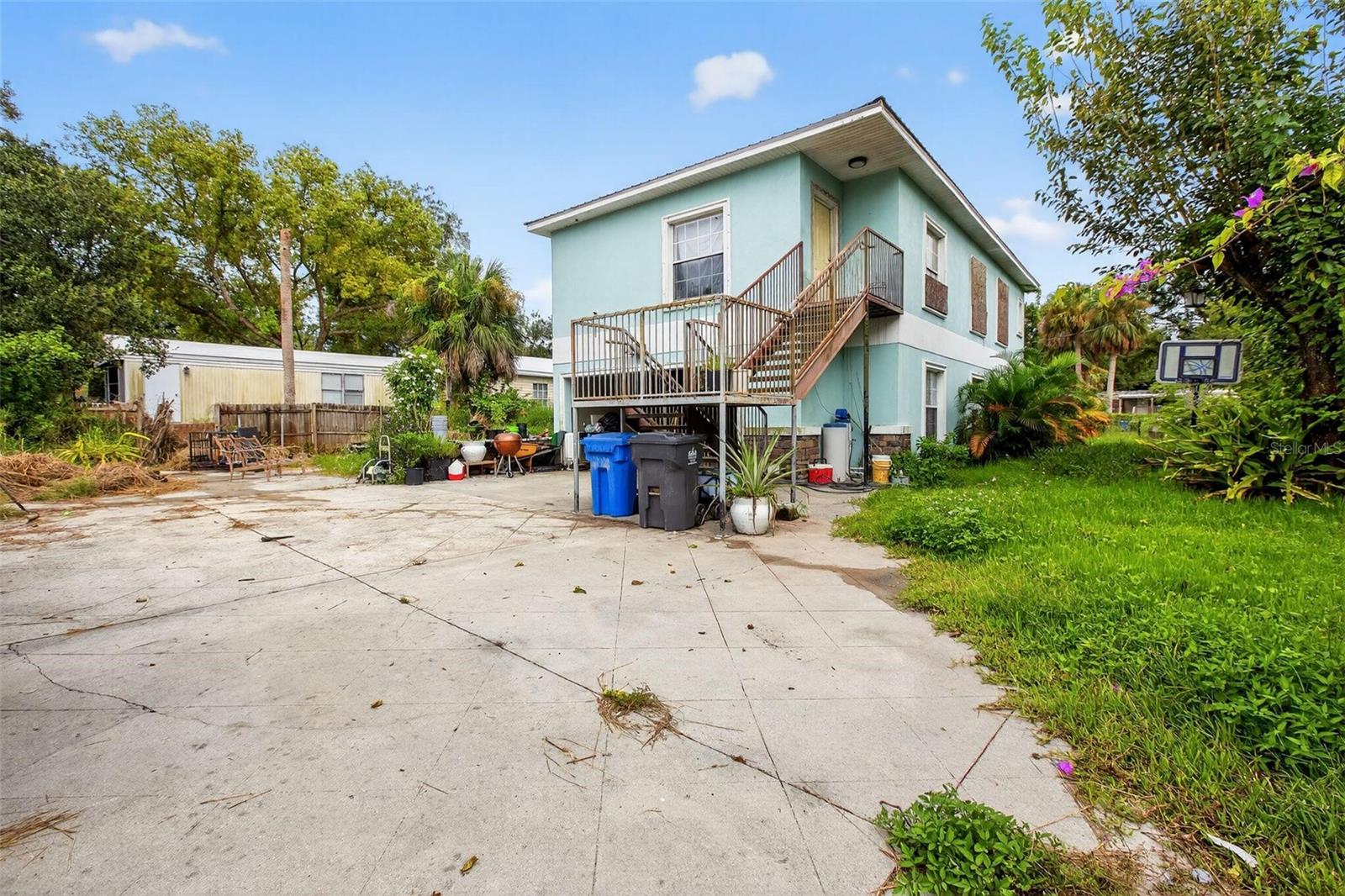 Handyman special!! This unique two-story home stands out with its spacious design and garage beneath the living space, large enough to fit up to 3 cars, making it good for storage, hobbies, or even creative income potential. In need of some TLC, this property will make a great investment opportunity once it's brought back to life. Conveniently located in Gibsonton, you’re just minutes from the Alafia River for boating and fishing, a short drive to vibrant downtown Tampa, and close to the sandy shores of Apollo Beach offering the perfect balance of convenience, lifestyle, and opportunity.