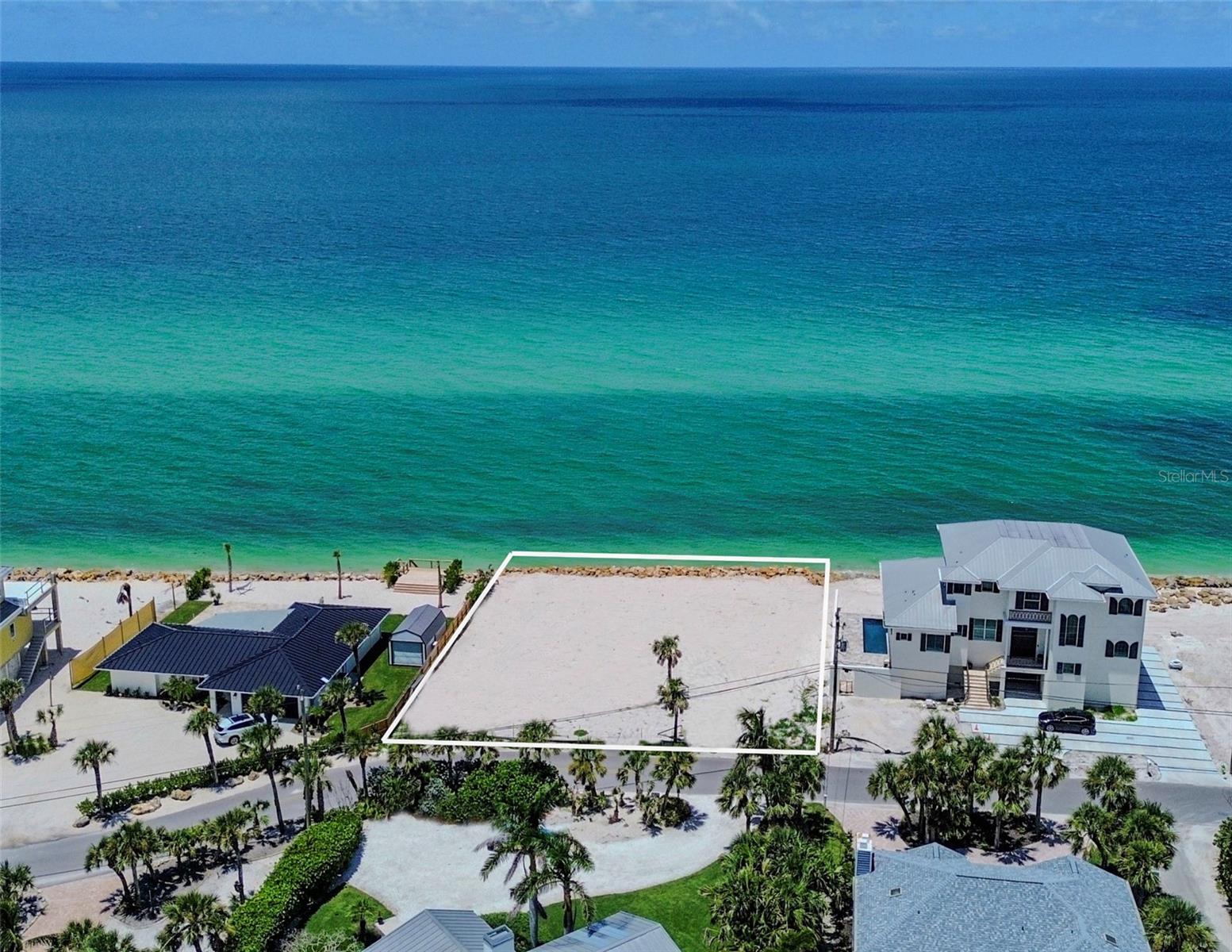 Discover one of Casey Key’s most coveted Gulf-front parcels, boasting 0.43 acres with 107 feet of pristine frontage and uninterrupted views of the Gulf. This rare property presents an extraordinary opportunity to create a custom waterfront estate, backed by an approved Coastal Setback Variance Permit allowing for a residence of approximately 3,500 square feet. This is not just a homesite, it’s an invitation to design a legacy. Experience the magic of year round sunsets, the sound of the surf just beyond your door, and the privacy of a location tucked away yet just minutes from the Blackburn Point Bridge for quick access to Sarasota’s dining, culture, and entertainment. Few parcels remain where you can craft a Gulf-front retreat of this caliber. Secure your place on one of Florida’s most treasured barrier islands and build a home worthy of its setting. Explore MLS#A4664842 to discover the renderings and build opportunities for an exceptional residence.