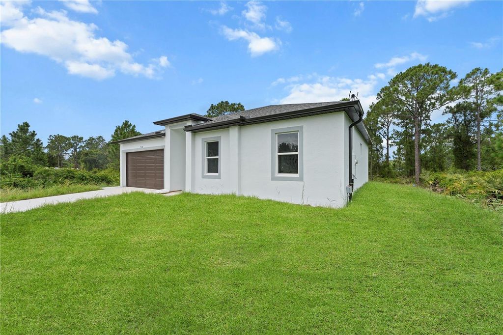 Photo of 718 Drury Avenue, Lehigh Acres, FL 33974 (MLS # A4669966)