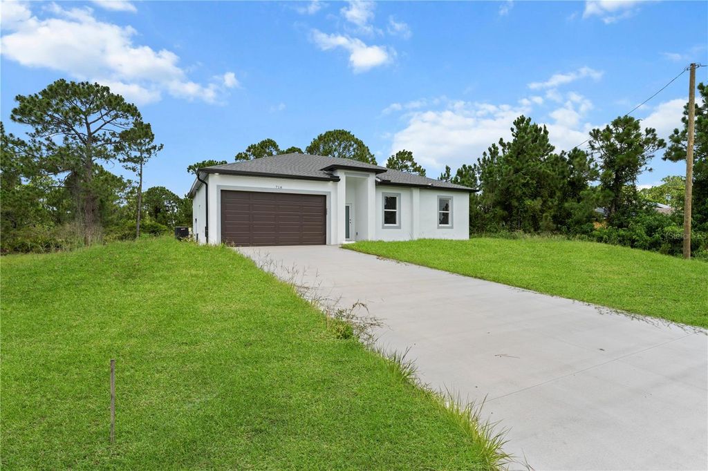 Photo of 718 Drury Avenue, Lehigh Acres, FL 33974 (MLS # A4669966)