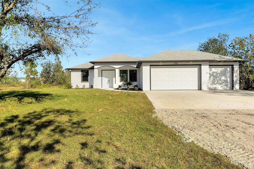 This brand-new home in the country is a dream come true.  It boasts four bedrooms, 2 bathrooms and a 3-car garage!  Designer finishes including 8-foot doors, porcelain tile, stainless appliances, open floor plan and a kitchen any cook would love to have.  You'll love the peace and quiet of country living with plenty of space for your family to spread out and enjoy the 1.25 acres.  It is the perfect blend of luxury while living in the country but still being close to town.  Level 2 quartz one slab countertops and backsplash with veining throughout, large island with sink and microwave with pullout drawer, all the appliances are stainless including French door refrigerator.  Floors are wood look porcelain, neutral colors throughout home, all you need to do is add furnishings.  8 foot pocketed sliders lead out to lanai with a view of the expansive backyard, plenty of room for barn, workshop and/or pool. Natural landscaping left around perimeter but plenty of room for yardscaping and gardening.  Partially fenced already too!  Don't miss the chance to make this one your own!