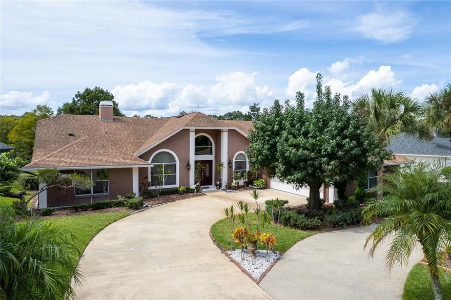 Located in the highly sought-after Seneca Bend community of Tuscawilla, this 5-bedroom, 4-bath pool home offers over 3,100 square feet of living space with a desirable split floor plan designed for both comfort and entertaining. The home features formal living and dining rooms for elegant occasions as well as an oversized family room with soaring vaulted ceilings, a cozy wood-burning fireplace, and expansive sliders that open directly to the covered patio and pool area. The kitchen showcases custom cabinetry, stainless steel appliances, a stylish backsplash, and a breakfast nook that—along with the family room and two bedrooms—provides direct views of the serene pond and wooded preserve. The pool and patio are a true highlight, offering abundant space for relaxing and entertaining while enjoying sweeping views of the water and the preserve backdrop, creating an unparalleled sense of privacy. Outdoors, the tranquil pond is bass-stocked and the preserve ensures year-round seclusion, making the setting feel like a private retreat. Additional conveniences include an EV charger in the garage, and the location places you within the coveted Tuscawilla lifestyle, with nearby access to championship golf, tennis, fitness, and dining at the Tuscawilla Country Club, along with top-rated schools, UCF, shopping, entertainment, and easy commuting via 417.