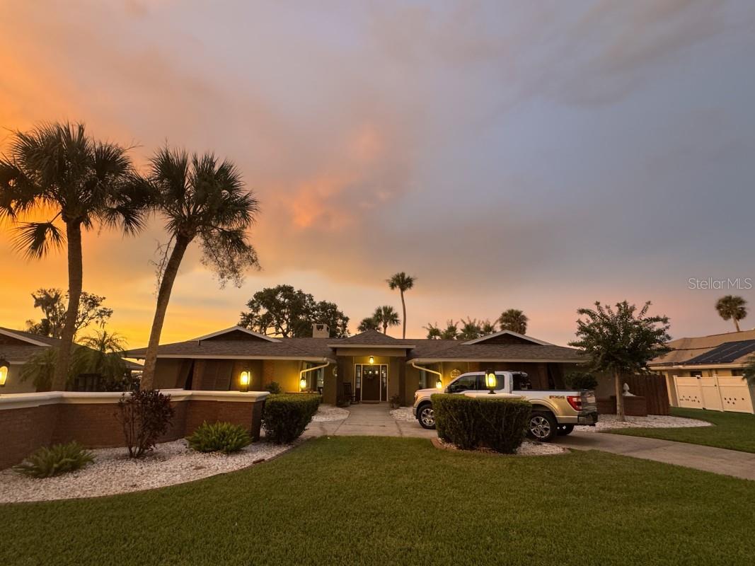 Owners Selling desirable Lake Harris home!
Discover lakefront living at its finest with this stunning 3-bedroom, 2.5-bathroom home featuring 2,471 SF of thoughtfully designed space and lanai that runs the length of the house with new bug proof screens. The property has 135 feet of direct Lake Harris frontage on the coveted Harris Chain of Lakes, at the end of a cul-de-sac offering the perfect blend of privacy, relaxation and recreation. The heart of this home showcases a comfortable living area that is open to an updated kitchen, a walk-in pantry, separate laundry room and updated bathrooms, while generous closets provide ample storage throughout.
A flexible space adds versatility for your lifestyle needs, whether you envision a home office, a formal dining room, or a hobby room. The spacious primary bedroom, living room, and kitchen/dining room all have views of Lake Harris, and additional bedrooms offer comfortable guest accommodations. All ceilings have been replaced with modern, clean drywall and the living room vaulted ceilings with wood. There are two electric fireplaces with heaters, and the central a/c system is maintained by a local contractor twice per year.