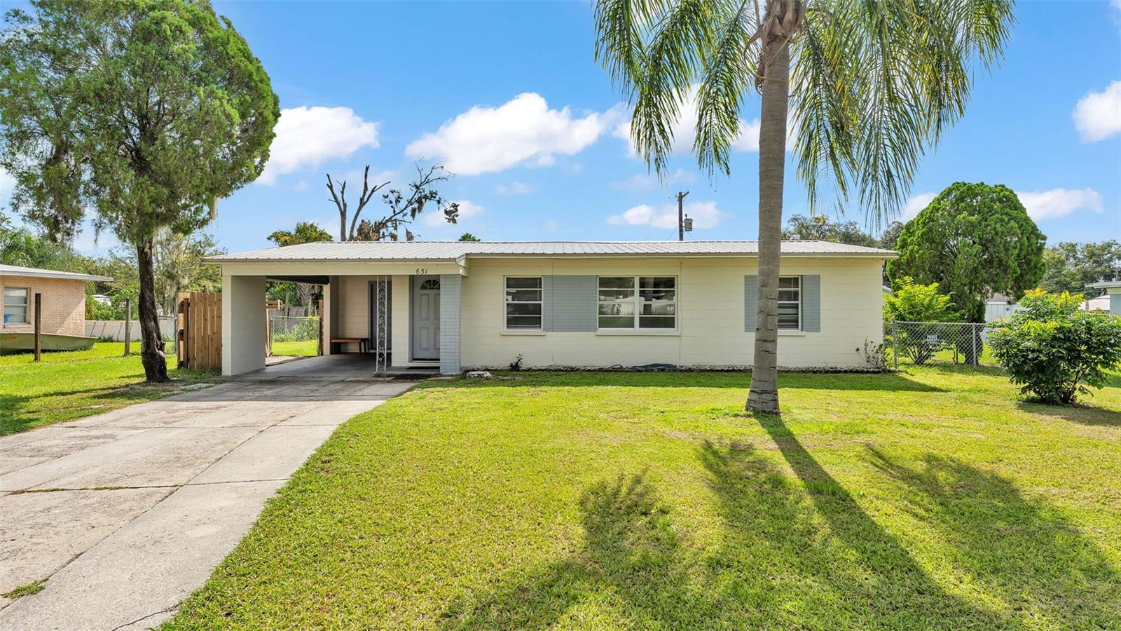 Welcome to 631 Carolyn Drive, a charming 3-bedroom, 1-bathroom block home nestled in the heart of South Lakeland. This cozy residence sits on a concrete foundation and features a recently installed metal roof (just 3 years old) and a newer air conditioning system (only 2 years old), offering peace of mind and long-term value. The home boasts a spacious backyard—perfect for entertaining, pets, or gardening—and includes a single carport with an attached laundry room and convenient access to the yard. Situated off Cleveland Heights Boulevard, this location provides quick access to South Florida Avenue and the Polk Parkway, making commutes to Tampa and Orlando easy and efficient. Enjoy being minutes from local favorites such as Lake Hollingsworth, Cleveland Heights Golf Course, Peterson Park, the new Lakeland YMCA (with childcare, pool, gym, and more), Common Ground Park, and the Lakeland Country Club. With a variety of grocery stores, restaurants, shopping options, and the popular Lakeside Village just around the corner, 631 Carolyn Drive offers a blend of comfort, convenience, and classic Florida charm.