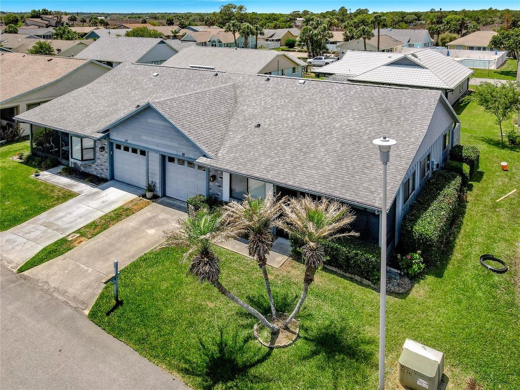 Photo of 49 Bogey Circle, New Smyrna Beach, FL 32168 (MLS # G5111516)