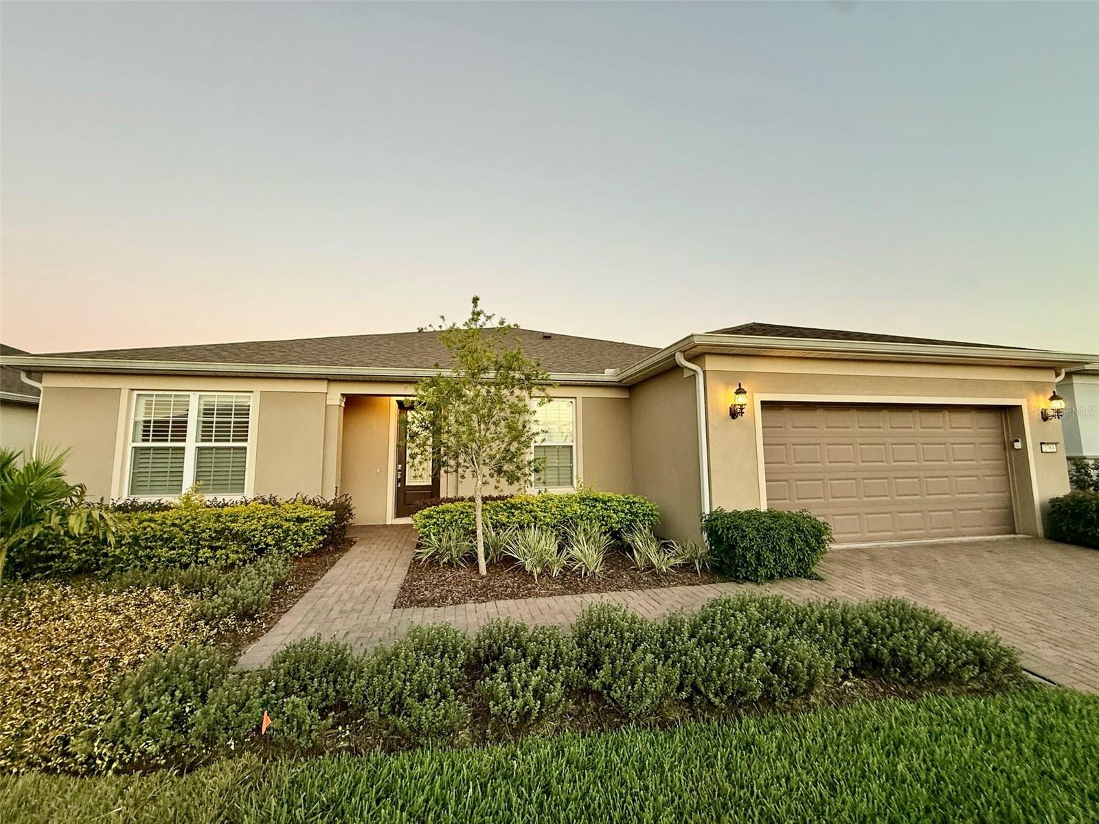 Welcome to this beautiful three-bedroom, two-and-a-half-bathroom home located in the highly sought-after Del Webb Sunbridge community in St. Cloud, Florida. This 55+ gated neighborhood offers a resort-style lifestyle with access to a clubhouse, community pool, fitness center, business center, tennis courts, and pickleball courts.
The home features a beautifully landscaped exterior and a modern interior with no carpet throughout, ceiling fans in multiple rooms, and smart-home technology. The kitchen is equipped with stainless steel appliances including a range, refrigerator, dishwasher, and microwave. The spacious primary bedroom offers a large walk-in closet and a luxurious walk-in shower, while the open-concept living area provides plenty of space for relaxation and entertaining. Enjoy Florida living at its best in the screened-in patio with a private spa—lawn care and spa service are included in the monthly rent for added convenience. This solar home includes a $150 monthly solar fee and offers washer and dryer, water softener, and electric car charger hookups as a convenience only. The property also features a two-car garage and can be rented furnished or unfurnished. Pets up to 35 pounds are welcome with an approved application and applicable fees and rents. Home has gas utilities, blinds throughout, and access to top-tier community amenities, this home combines modern comfort, energy efficiency, and active living. HOA Application & Approval Required. Schedule your private showing today and make this beautiful Del Webb Sunbridge home your new retreat.
All our residents are enrolled in our Resident Benefits Package for $55.00 per month, charged as additional rent. This package includes Pest Assurance powered by Pest Share, access to an online resident portal, and availability of a dedicated 24/7 maintenance portal. Additionally, it offers monthly reporting of rental payments to Experian RentBureau, bi-monthly home delivery of replacement HVAC filters, and the use of resident-completed inspection technology. Residents are entitled to one late fee waiver during their residency and have access to concierge utility services. They are also eligible for a $1500 credit towards closing costs if they employ an AMG Realty Services Sales Agent as their buyer’s agent.
