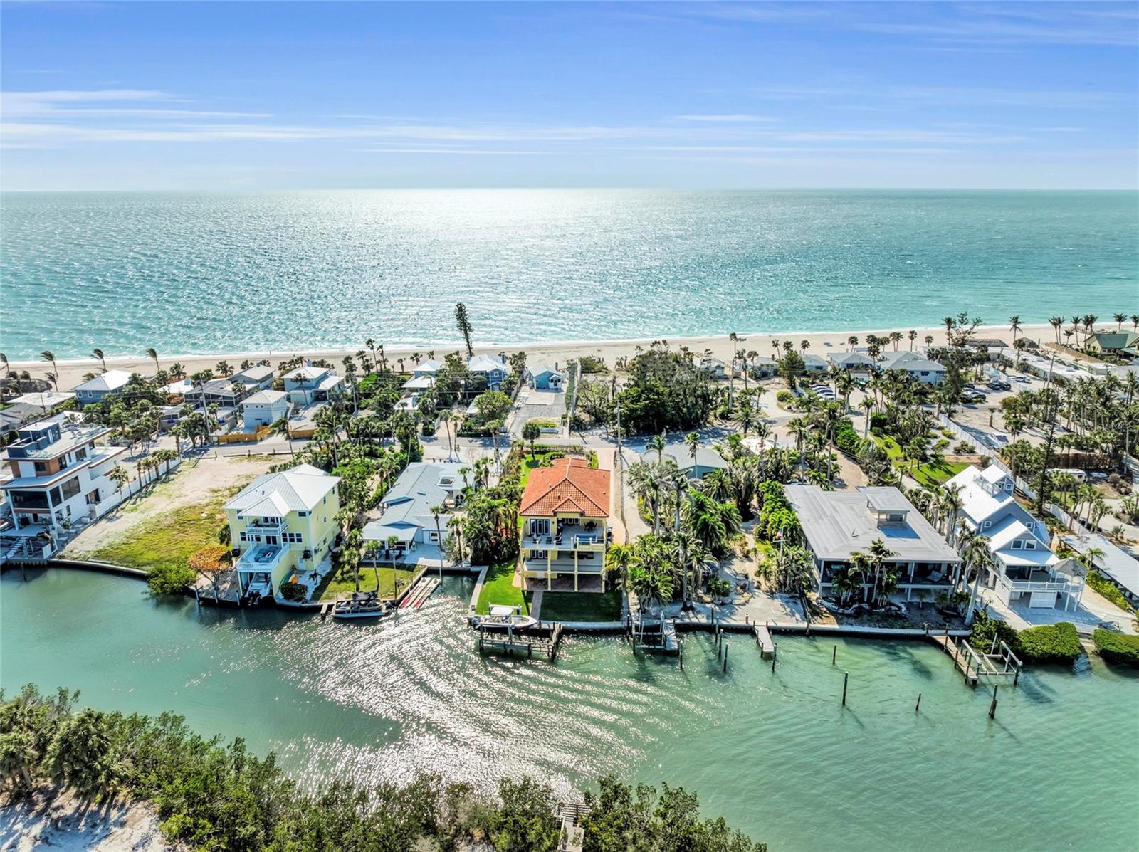 Welcome to 416 Casey Key Rd – an exceptional waterfront estate offering private Gulf beach access, spectacular views, and elevated, storm-safe construction on one of Florida’s most exclusive barrier islands. This three-story concrete block home offers timeless coastal design paired with the latest modern features for seamless living and entertaining.
Inside, you’ll find four spacious bedrooms, each with water views, en-suite bathrooms, and walk-in closets. The primary suite features two custom closets, blackout blinds, and a luxurious bathroom with dual vanities, his-and-her showers, a soaking tub with a view, and stunning finishes. The lower level includes a game room and a spacious four-car garage with a convenient half-bath.
The open-concept main living area showcases engineered wood floors, crown molding throughout, and flows effortlessly onto a large covered balcony with an outdoor kitchen, spa, and breathtaking water views. The gourmet kitchen is outfitted with JennAir appliances, a gas fire stove, a sink with panoramic views, and quartz counters—perfect for everyday cooking or entertaining. A Control4 smart home system, integrated sound both inside and out, Luma exterior cameras, and a whole-home alarm system ensure convenience and peace of mind.
This home is designed for resilience and comfort, with hurricane-impact windows and doors, buried power lines for storm protection, a brand-new generator (installed 2024), a buried propane tank, and a seawall and boat dock that are both newly upgraded. The 35 ft private dock with all-new equipment is ideal for boaters, while the property’s private beach access invites daily sunsets and strolls on the sands of the Gulf of America.
Additional highlights include a two-person elevator (950 lb capacity), three zoned A/C units (one brand new), two tankless water heaters, a well for irrigation, plantation shutters, a laundry room on the second level, and lush St. Augustine grass. The property also features a septic system and plenty of additional storage throughout.
Set in the beautiful and peaceful enclave of Casey Key, this residence offers an unrivaled coastal lifestyle just minutes from the boutiques, restaurants, and cultural amenities of both Venice and Sarasota. With direct access to boating, beach, and breathtaking scenery, this is a rare opportunity to own a truly exceptional waterfront home.