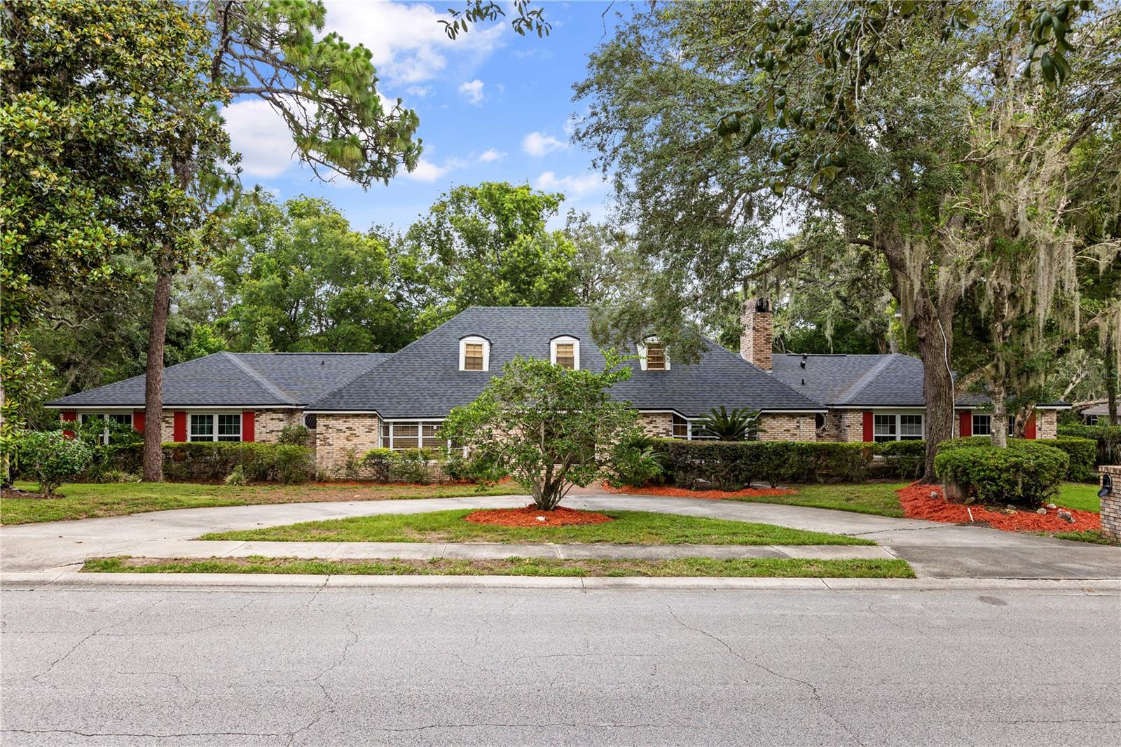 Welcome to 105 Smokerise Blvd—an expansive 4,618 SqFt estate in the heart of Longwood. Known for its lush natural surroundings, private park, community boat ramp, and access to Lake Brantley and Sweetwater Beach - this neighborhood has it all!
This 5-bedroom, 4-bathroom home is a rare blend of size, character, and functionality. From the moment you enter, you're greeted by cathedral ceilings, skylights, and a dramatic brick wall fireplace that anchors the spacious living area. The large family room features a built-in wet bar, ideal for entertaining, while the Florida room with double sliders brings the outdoors in—offering beautiful views of the screened-in pool, hot tub, and generous patio space perfect for year-round enjoyment.
Every bedroom includes walk-in closets, and the oversized den features pocket doors for a quiet retreat for working from home or hosting guests. A spacious upstairs bonus room provides endless flexibility—whether for a playroom, gym, or second living space.
This home has the layout, size, and features that today’s buyers crave, all set within a community that embraces nature and recreation. Enjoy scenic walking trails, private water access, and community events just minutes from top-rated Seminole County schools, Wekiva Island, shopping, and dining.
Your Longwood lifestyle begins here—spacious, serene, and surrounded by everything that makes this neighborhood truly special.
<iframe src="https://www.zillow.com/view-imx/acfe98d1-8490-4928-af57-91b49dc89c3c?setAttribution=mls&wl=true&initialViewType=pano&utm_source=dashboard" width="100%" height="790px" frameBorder="0" style="border: 0;"></iframe><br>Brought to you by <a href="" target="_blank">The A List</a>