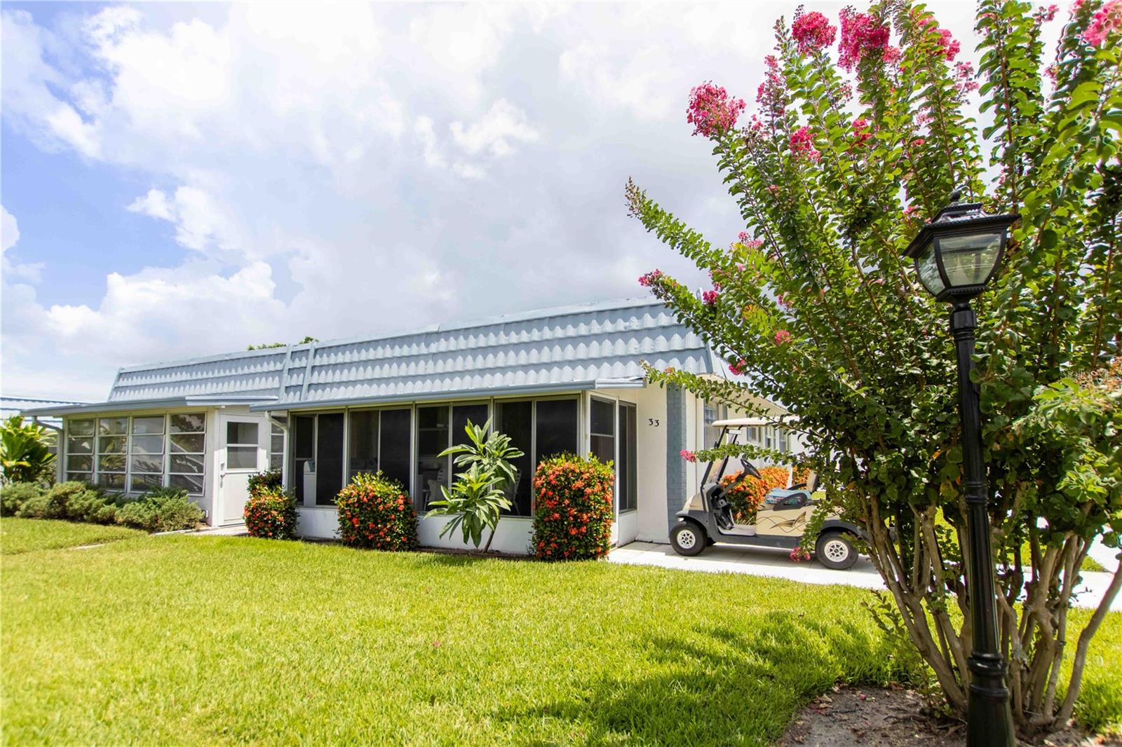Gorgeous and affordable Two Bed, Two Bath condo in thriving Kings Point. Enjoy the updated LVP flooring throughout, open floor plan, spacious bedrooms, Walk-In Primary bedroom closet, and recently updated Walk-In shower. Living room boast a beautiful custom built in bookshelf to add character and provide additional storage. Private lanai is perfect for enjoying the Florida weather. Condo comes with a community storage unit (pictured) and 1 reserved covered carport. HOA Fees includes almost everything! Cable, Internet, Water, Trash, Sewer, Lawn Care, Roof Care and Replacement, Exterior maintenance and painting! Not to mention all of the amazing clubs and amenities Kings point is famous for. Don't miss your opportunity to own an affordable piece of paradise. Schedule your showing today!