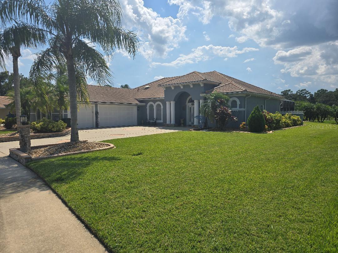 The property located at 3606 Maribella Dr, New Smyrna Beach, FL 32168 is a single-family home in the Venetian Bay subdivision. It was built in 2005 and has a tile roof. This home features:
3 bedrooms and 3 bathrooms.
An open floor plan.
A spacious master suite with wood flooring, crown molding and a walk-in closet.
A master bath with a soaking tub, large tiled walk-in shower and pool access.
Kitchen with wood 36''cabinets, granite counters and stainless steel appliances.
Oversize 3-car garage.
Screened patio with a pool fountain, salt water, and solar heated pool.
Located on a corner lot overlooking pasture land for privacy.KitchenAid Refrigerator, Stove and Microwave appliances included
Kenmore Elite large capacity electric Washer and Dryer included.
Pool has a rooftop passive (non-electric) Solar-Fit Pool Heater.
Pool is a smaller capacity pool with swim out portion located at one end. 2 Waterfalls. ~10,000 gallons. Salt Water pool with Hayward Chlorinator type system for generating Chlorine. Variable Speed Pool Motor for efficiency.
The HVAC is an American Standard system. Unit is enclosed within the home environment for efficiency. It is 20 years old, but has been maintained by the homeowner.
Rainbird irrigation system.
Hurricane Panels for doors and windows, except for 2 sliding patio doors in the Lanai Pool area.
Tile Roof. Original.
House painted in 2022.
Garage Door Openers have battery back-up.