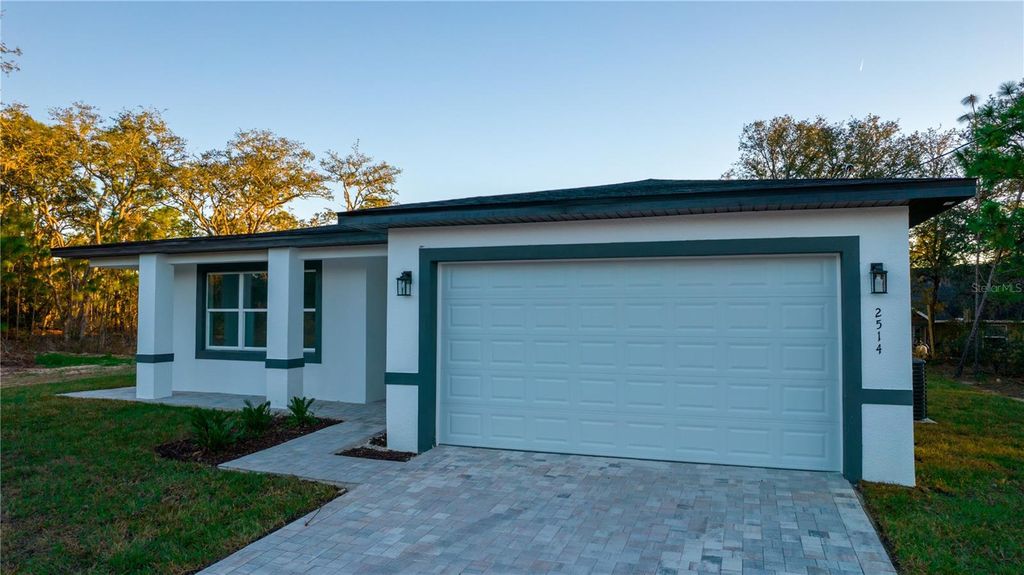 Photo of 10034 N Darwin Way, Citrus Springs, FL 34434 (MLS # O6323139)