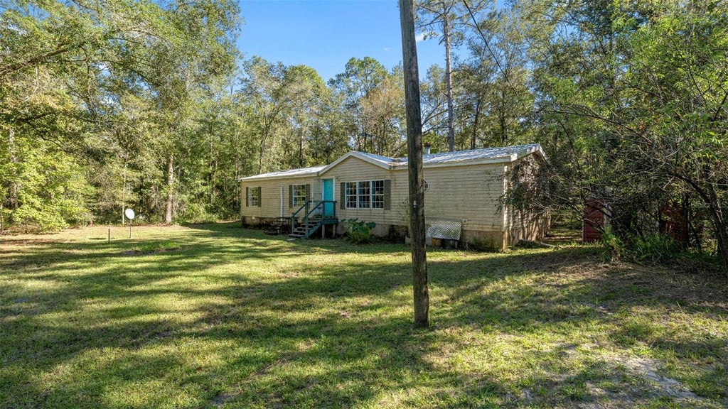 Photo of 4817 NW 244th Avenue, Alachua, FL 32615 (MLS # GC544307)
