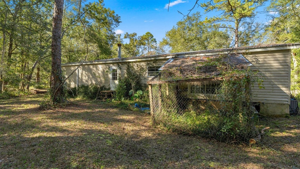 Photo of 4817 NW 244th Avenue, Alachua, FL 32615 (MLS # GC544307)