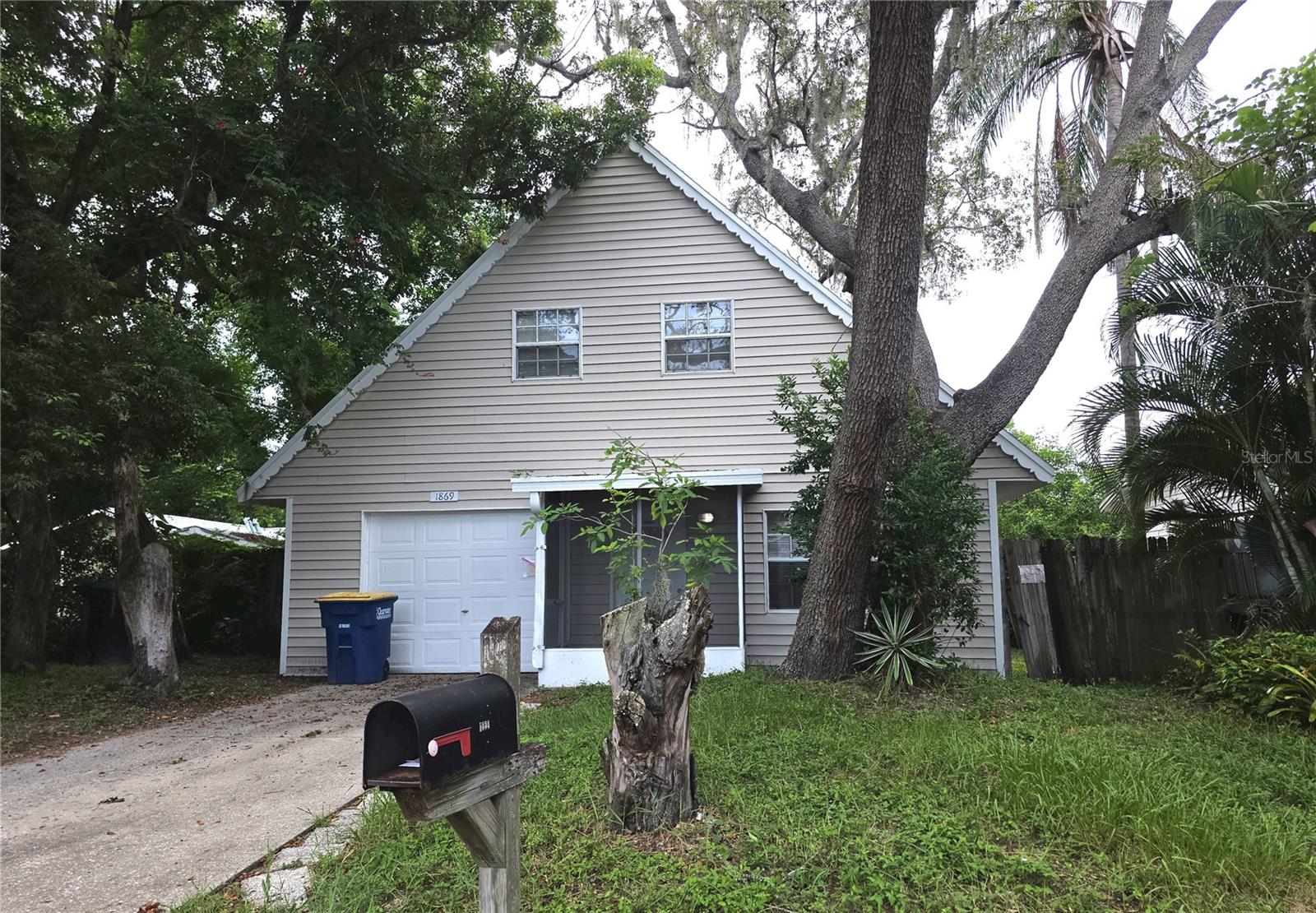 Enjoy this charming two story 3 Bedroom/1 Bath/1 Car Garage bungalow on tree shaded fenced lot. Home offers large living room. Updated kitchen that opens to dining room with access to rear yard. Home has been freshly painted, has new flooring, New HVAC and Roof. There is a den/3rd bedroom on the first floor and 2 large bedrooms seperated by the bathroom on the 2nd floor. Conveniently located to the Pinellas Trail this home sits between Dunedin and Clearwater Beaches as well as minutes to Downtown Dunedin.