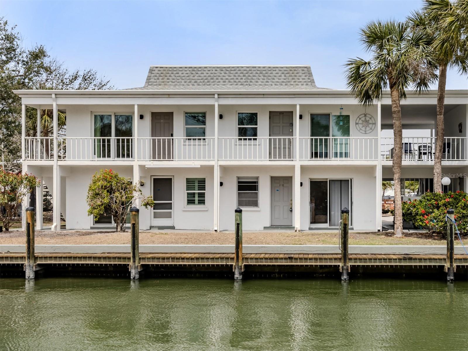 UNBELIEVABLE PRICE for this well-updated, fully furnished 2nd floor corner unit in beach and boat condo complex on Venice Island! View it ASAP, because it's truly a value offering that will go fast.
The redone interior is stylish, tasteful and move-in ready and the location is primo. From each room you could look out to see some type of waterfront scenery...north to the Intracoastal from the main bedroom, west to a peek of the Gulf and south from your main living area directly onto the canal, docks and boats. Just bring your toothbrush and move in...this is such a great deal that you'll have money left over for lunch with all your friends at the famous Crows Nest, just steps away!