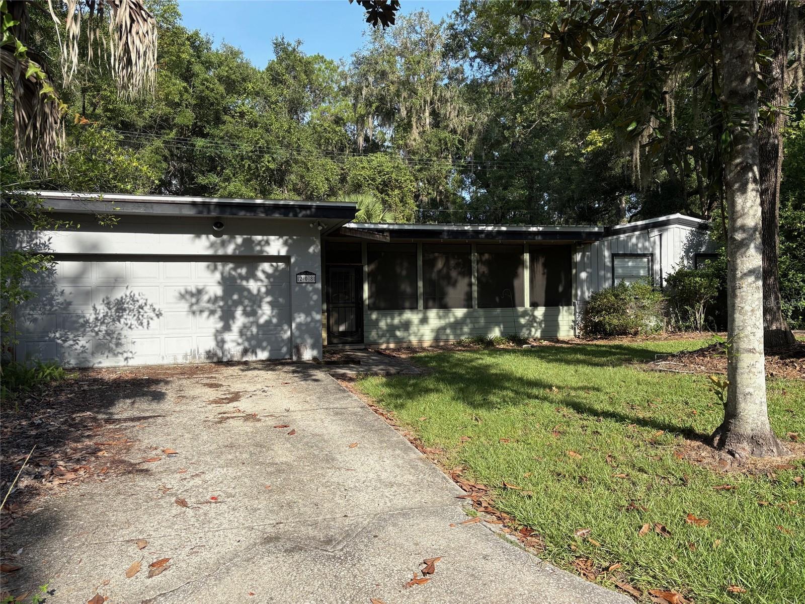 4 Bedrooms, 2 Bathrooms, living room, bonus room/study with built in desk/cabinetry, great room with fireplace and pool table, pass through kitchen, indoor laundry area with washer and dryer, and screened front porch complete with patio furniture and hot tub. This is our biggest house at over 3000 SF, and is cooled by two air conditioners. Half of the house (including one bedroom and the bonus room) does not have heat. The great room, bonus room, and kitchen are tiled, the living room and one bedroom have wood flooring, while the rest of the bedrooms are carpeted. House also has a two-car enclosed garage with electric garage door opener, a rarity for this neighborhood. House is located on a quiet residential street and is very close to the Royal Park shopping plaza and movie theater.