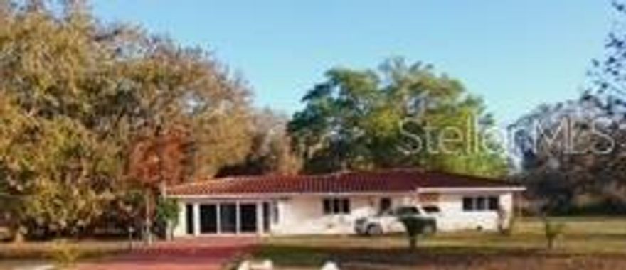 MOVE IN BY EASTER! This home sits on a natural lot with mature trees on a beautiful, privately maintained road in Indian Lake Estates (ILE), about 20 minutes East of Lake Wales. Park Avenue is the main road in the community, and it feels like a traditional neighborhood, until you look at the map and realize you are in the middle of over 4000 acres and adjacent to Lake Weohyakapka, the largest lake in Polk County. This is not a traditional property. The garage has been converted to a multi-purpose living area, plus enjoy the outdoor gathering spaces for entertaining. The kitchen has more cabinets than you will ever need. And this open floor plan still allows privacy for everyone in the family. ILE is a deed-restricted community, with a clubhouse and private golf course, and a fishing pier on the largest lake in Polk County less than a mile away. The social activities are everywhere! Dances, Bingo, Karaoke, Trivia Night, Pavilion Breakfasts, Book Club, Card Nights, Pickleball, just to name a few. Walk, ride your bike, take the kids to the clubhouse playground, eat at one of the three restaurants in the neighborhood, and then return home to your private retreat. Indian Lake Estates is the perfect blend of activities and privacy.