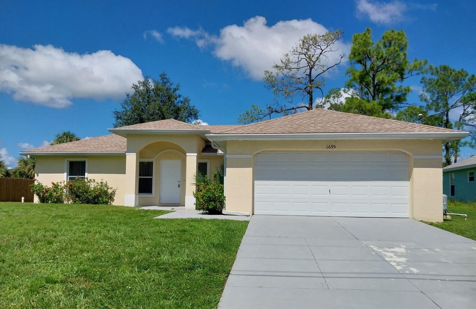 Beautiful home in a quiet neighborhood features a light and bright open floor plan design with vaulted ceiling, 3 Bedrooms, 2 Baths, and 2-Car garage. The 3-panel sliding glass door in the living room leading to a screened Lanai expands space when entertaining family and friends. You can enjoy an easy and fun lifestyle in this conveniently located home within 3 miles from shopping, restaurants, golf courses, parks, schools, fitness centers, medical facilities and with an easy access to I-75 for commuters. Sparkling beaches are also within 26 miles. Call now to make this your new home!