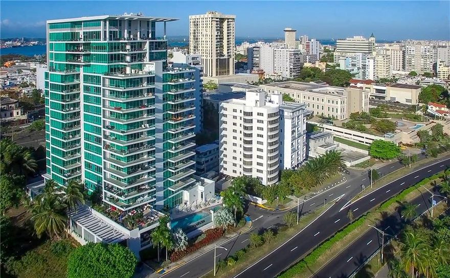 Masterful design and modern luxury are uniquely embodied in this sub-penthouse located in Cosmopolitan, the most secure residential building in San Juan.  The 3-bedroom, 4.5-bath residence has a total of 4,307 sqft., with floor to ceiling glass and north/east exposures providing extraordinary direct views to the Condado Lagoon, the Atlantic Ocean and the sunrise over the San Juan skyline and mountains.  Step outside onto one of the oversized covered terraces and enjoy the outdoor kitchen, fresh air and the scenic views.  Renovated in 2019 the top of the line kitchen features custom Poliform cabinets, marble countertops and professional grade appliances including Sub-Zero, Wolf and Miele. The divine master suite also enjoys floor to ceiling glass, an oversized his and hers closet and opulent master bathroom with a standalone soaking tub and separate glass shower. Featuring Control4 home intelligent system the residence is fully automated. This smart system controls not only the lighting and the audio but the temperature as well.   The property includes three parking spaces on the first floor of the garage and an oversized storage room unique to this residence only.   

The Cosmopolitan building is located the Arts District of Miramar, where you can enjoy a short walk to the conservatory of music, local restaurants, movie theaters, parks and outdoor activities.  The building has 24/7 security and concierge for the service of the residents. As part of the amenities for residents are a recently renovated infinity pool and outdoor common space, executive conference room, lounge bar, pantry and kitchen area for activities, billiard table, children play area and gym facilities.