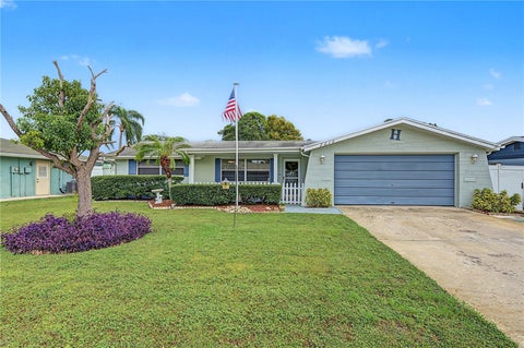 Photo of 7512 Holly Lake Lane, New Port Richey, FL 34653 (MLS # TB8555643)