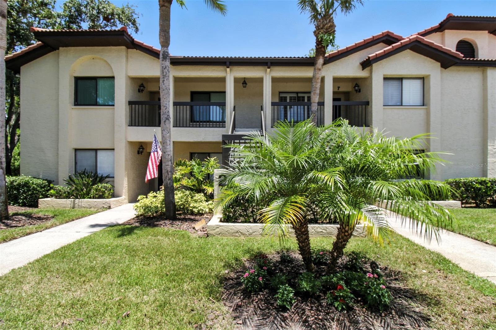 Immaculate Condo in the Heart of East Lake. Nature Views, Soaring Ceilings & Prime Location!
Welcome to your future sanctuary in one of East Lake’s most picturesque and desirable communities! This beautifully maintained 2-bedroom, 2-bathroom condo offers an exceptional floor plan and tranquil views, the perfect blend of comfort, privacy, and potential. Step inside to find an inviting foyer that opens into a spacious living and dining room combo, ideal for entertaining or quiet evenings at home. A water softener has been added for delivering smooth, spot-free water throughout, protecting your plumbing and appliances while elevating everyday comfort. The kitchen features a double sink with garbage disposal, and a sun-drenched eat-in nook that’s perfect for your morning coffee. The primary suite is tucked away at the back of the home for maximum privacy and already features a newly renovated bathroom. Your guests will enjoy their own suite at the front, complete with a pocket door and full bath, a perfect setup for hosting or multi-generational living. The second bedroom easily converts to a home office for those who work remotely or desire a flex space. Enjoy peaceful mornings and serene evenings in your air-conditioned lanai, overlooking lush greenery and serene views. With ample storage, natural light throughout, and high ceilings that enhance the sense of space, this condo truly feels like home. Community amenities include a heated/cooled pool, car wash station, and scenic walking paths. HOA covers cable TV, water, sewer, and trash, offering excellent value and low-maintenance living. Located just minutes from top-rated schools, world-class beaches, golf courses, restaurants, parks, and only 30 minutes to Tampa International Airport, this is a rare opportunity in a prime location. Priced to sell. Schedule your private tour today and see the potential to make this hidden gem truly yours!