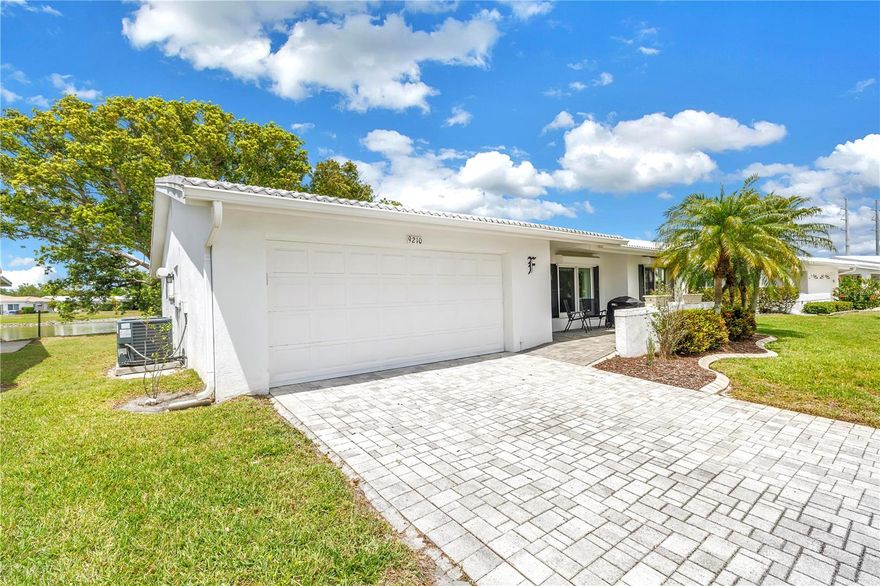 Experience the Ultimate Florida lifestyle in the vibrant 55+ community of Mainlands of Tamarac by the Gulf. This beautiful maintained, 1797 sq. ft. waterfront home (Phil O’Dendron model) offers a perfect blend of modern updates and tranquil views. Home Highlights: Spacious Layout with 3 bedrooms, 2 bathrooms, and a 2-car garage featuring a function split floor plan. Modern Kitchen and Baths recently renovated with granite countertops, new cabinetry, stylish backsplashes, and updated plumbing/fixtures. Chef extras include a custom-made movable kitchen island with matching granite and a large pantry for ample storage. The Primary Suite features a generous walk-in closet. Key upgrades include 2-year-old HVAC system and updated electrical throughout. Storm protection: this home is equipped with steel hurricane roll-down shutters, a hurricane-proof garage door, and newer double-pane windows. Outdoor living at its best. Enjoy a screened porch with ceiling fans overlooking the lake or relax on the paved, covered front patio. Community and Lifestyle. Active living at its best. Surround yourself with an 18-hole golf course, clubhouse, heated pool, and shuffleboard. Maintenance-Free with low monthly HOA dues of $353.00 (Unit 5 is well-funded with strong reserves). Pet Friendly and up to two pets welcome (35 lb. max).