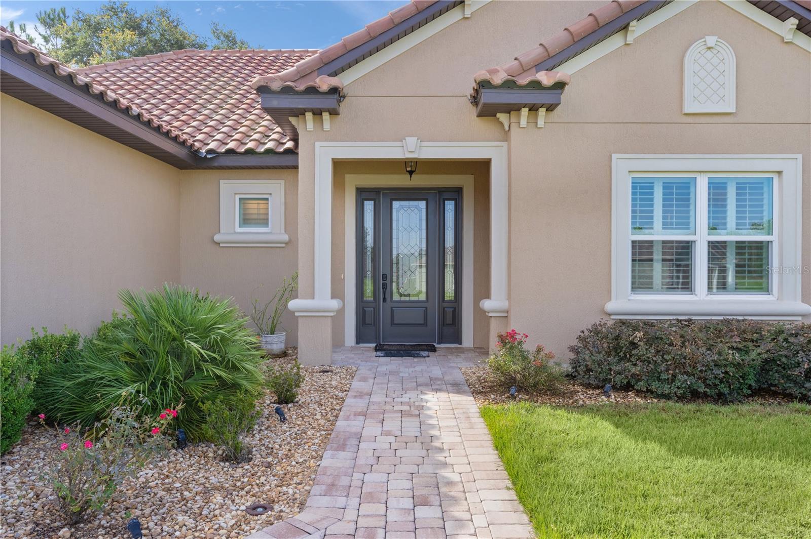**MOTIVATED SELLER** Welcome to the Gated Community of Juliette Falls. The Stunning 2023 Designer “Deluxe Ruby” home, built by Crouch Homes LLC is located on the 1st FAIRWAY of the Award-Winning Juliette Falls Golf Course and is the Top 10 Courses in the Nation and Top 3 in Florida. This designer home features 4 bedrooms and 2.5 bathrooms, 3-Car Garage spanning 2,392 square feet, Golfer Enthusiast will want this VIEW OF THE GOLF COURSE, enjoy a cup of coffee or a glass of wine while enjoying the golfers at the first green. The 15x18 COVERED LANAI and the Designer PAVER PATIO full length of rear of home are great places to entertain. Upon entering the home, you will be captivated by the airy OPEN FLOORPLAN, PLANTATION SHUTTERS, highlighted by a spacious 20' x 22' Living room adorned with impressive 10-foot COFFERED CEILINGS featuring track Lighting. The Kitchen boasts custom Cabinetry with Soft-Close doors, Under-Cabinet Lighting with under-Crown Molding, QUARTZ Countertops, a stylish TILE Backsplash, STAINLESS STEEL Appliances, a BUILT IN OVEN and Microwave, a cozy coffee bar, and a well-appointed dining room. The Primary Suite, measuring 19' x 15', offers TRAY CEILING, DUAL WALK IN CLOSETS, En-Suite Bathroom with DUAL VANITIES with under-cabinet lighting, GRANTITE COUNTER, a luxurious TILED WALK-IN SHOWER. and Private Water Closet. The Guest bedrooms provide generous proportions and sufficient closet space. The Guest Bathroom also includes Custom Cabinets with under-cabinet lighting, GRANITE Countertops, and TILED WALK-ON SHOWER. For added convenience, the Laundry Room measures 10' x 14' and includes a built-in sink and extra counter space for laundry organization and added PANTRY STORAGE. The half bathroom features Custom Cabinetry with under-cabinet lighting and GRANITE counters. No home would be complete without a PAVER DRIVEWAY with a 3-CAR GARAGE, which showcases beautiful EPOXY Floors, ELECTRIC CAR CHARGER and ample space for vehicles and recreational equipment. The Attic is equipped with Pull-Down Stairs and is fully decked for additional storage. This home is loaded with upgrades, including LAMINATE FLOORING throughout the main living areas, 6" CROWN MOLDING, an upgraded front door, recessed LED Lighting, and 8-foot tall Interior Doors. The local Pro-Shop has golf apparel, golf clubs, golf balls, shoes, bags, and golf-themed gift items. Juliette Falls Bar & Restaurant has wide variety of delicious options daily and 1st Friday Evenings. Stop at the Driving Range and visit the Blue Bar, also known as the "19th hole" after your round and cool off with for an ice cold beer! Juliette Falls is Located just 15 miles from Ocala and the renowned World Equestrian Center, you can discover the charm of Dunnellon—a town rich in history, culture, and natural beauty. Experience the breathtaking scenery of Rainbow Springs State Park, where you can float down the world-famous Rainbow River. Golfer Enthusiast Dream Location.