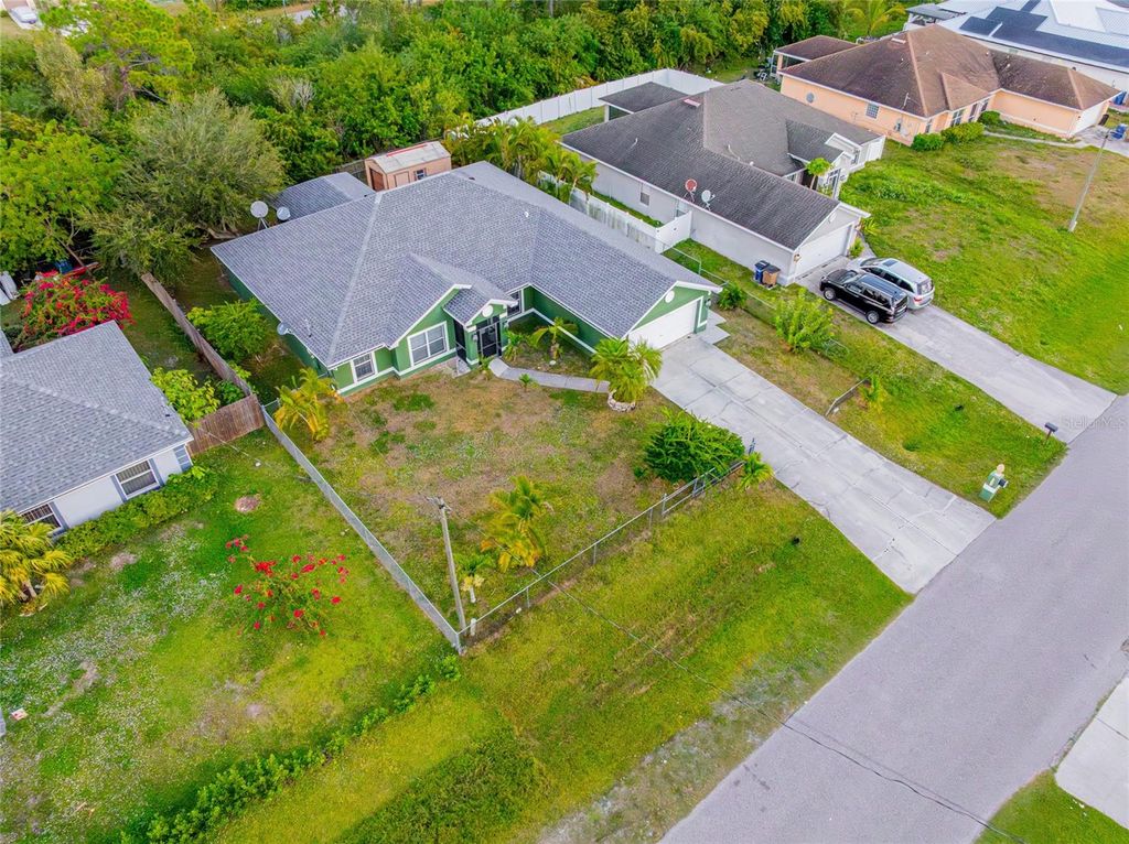 Photo of 418 Windermere Drive, Lehigh Acres, FL 33972 (MLS # TB8458977)