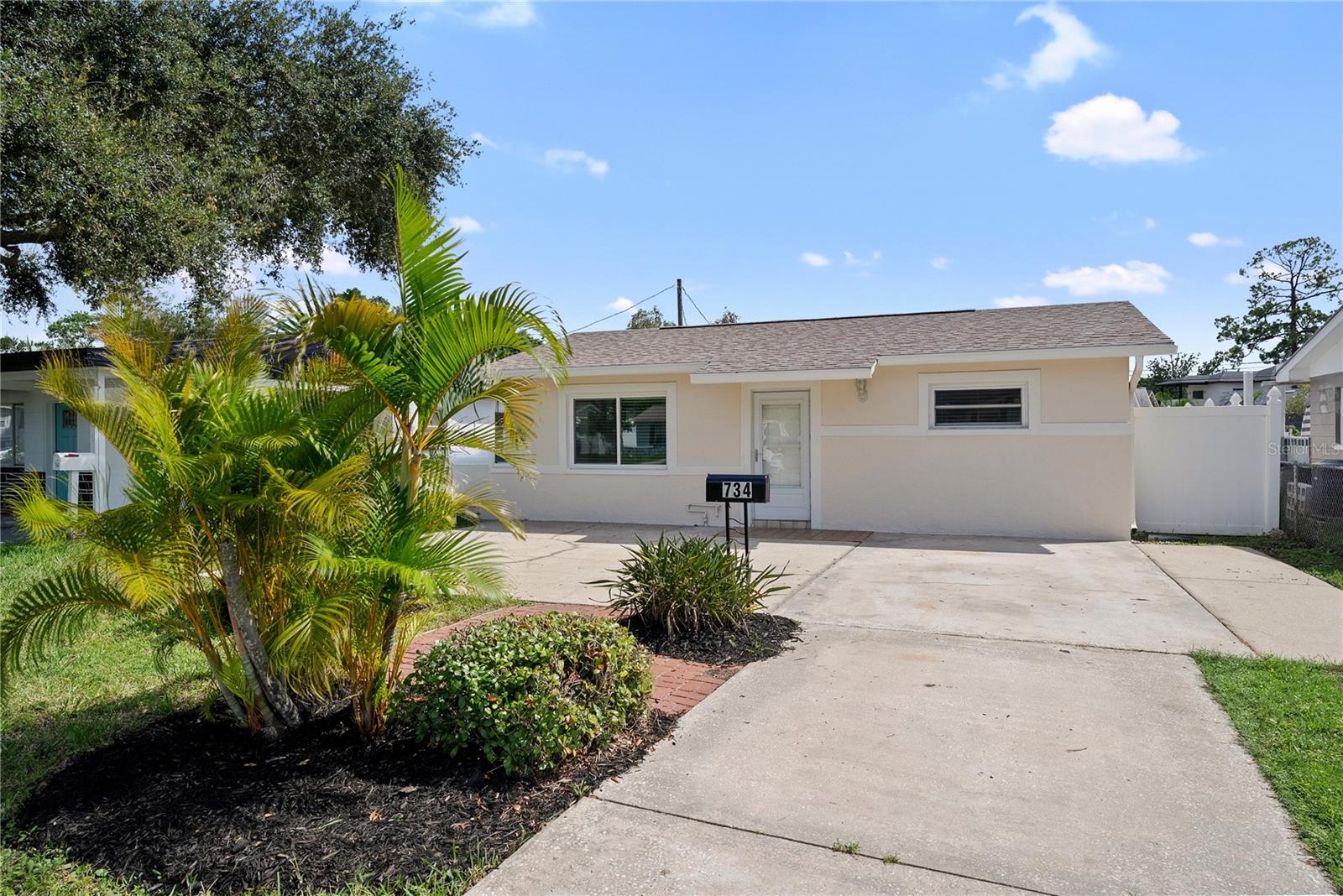 Welcome to your St. Pete oasis! Just off 4th Street in a prime location, this 4-bedroom, 2-bath home blends modern
updates with resort-style outdoor living. Step inside to find fresh NEW flooring, two brand-new bathrooms, fresh interior
and exterior paint, and stylish finishes throughout The kitchen features a NEW waterfall island with bar seating, modern
appliances, and a bold accent wall with a hidden, invisible-door entry to the laundry room — adding a touch of custom
character! The primary suite offers a walk-in closet and direct access to the pool and backyard, perfect for morning
coffee or evening swims. The true star of this home is outside. The backyard showcases a massive 20x40 pool with
spa, surrounded by travertine pavers and the covered patio makes entertaining a breeze — whether it’s Sunday football
with friends or a relaxing evening by the water. With a NEW roof and move-in ready updates throughout, this property
combines peace of mind with standout features. Don’t miss your chance to own a slice of paradise in one of St. Pete’s
most sought-after areas — schedule your showing today!