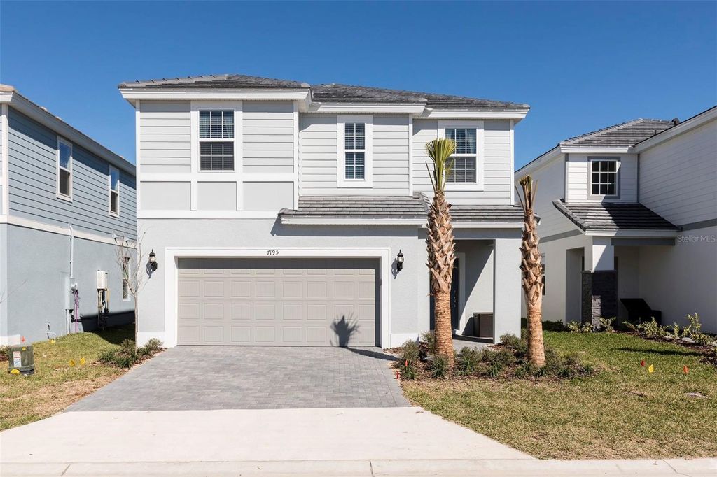 Photo of 7195 Oakmoss Loop, Davenport, FL 33837 (MLS # O6399547)