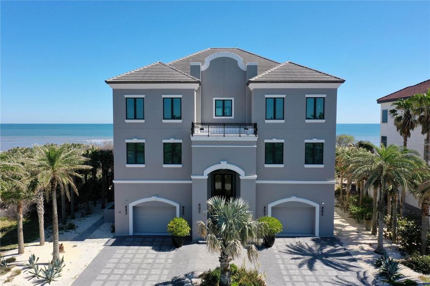 Looking for an OCEAN FRONT, custom built luxury home with WATER views from every room? Then put this AMAZING property at the top of your list! Truly a rare find, 45 Calle Del Sur boasts views of the ATLANTIC OCEAN to the East, North & South, and LAKE SAN GABRIEL to the West. Offering 5 bedrooms, 5 and ½ baths with 6,043 sf of living area. Located in the gated GOLFING community of Hammock Dunes. Hammock Dunes is a rare, One-Of-A-Kind community that is the gem of Florida’s east coast. The home offers a rare combination of luxury elegance with a causal, homey coastal vibe. The 2nd floor features a living room, kitchen, butler’s pantry, laundry & storage room. A powder room, elevator access and two on-suite guest bedrooms with custom closets and built-ins. One of the bedrooms has a private door out to a lanai that overlooks the Atlantic Ocean while the other bedroom has incredible views of lake San Gabriel. The living room has AMAZING views of the Atlantic Ocean with a linear fireplace & doors to the screened-in outdoor kitchen, open lanai with a generous seating area & fire pit.  Just off the living room is a spacious gourmet kitchen, no doubt it is a chef’s dream! Complete with two Wolf ovens, a gas stove top, subzero refrigerator with drawers, freezer drawer, wine refrigerator, a convection microwave. There is tons of storage and counter space. It has a wonderful flow and offers ocean views to the north & east. It is perfect for family gatherings & entertaining. The Butler’s pantry is just off the kitchen & is a wonderful, multipurpose space that can be used for enjoying your morning coffee or to keep the messy dishes out of the main kitchen while you are enjoying family and friends. There is plenty of seating as well! You can cozy up to the main island or relax at the table which boasts oceans views & has access to the outdoor kitchen. The third floor offers two primary suites with spa like bathrooms, a family room, office, elevator access & an incredible 5th bedroom with four bunk beds & a private bathroom. The living room has beautiful ocean views & a private door to the third-floor lanai. It also features a coffee & wine bar so you can enjoy the morning sunrise with a hot cup of coffee, & a glass of wine at the end of a long day. The office has East & South views of the ocean, 2 closets & can be used as a 6th bedroom. It also has a private door to the lanai so you can unwind & enjoy the ocean breezes. One of the primary bedrooms has a spacious bathroom with a towel warmer, large shower with a rain & handheld shower heads. A large custom walk-in closet with built-ins, lots of natural light & amazing views of lake San Gabriel. The other primary bedroom offers both east and north ocean views, a custom walk-in closet with built ins, a spacious bathroom with a warming drawer, soaking tub & a large shower with a rain & handheld shower heads. The 5th bedroom is a fun space. There are 4 bunk beds, each with a private light and plug for the telephones, etc. A view of lake San Gabriel, three closets, a built-in area with drawers & a private bath!  The 3,150 sf climate-controlled garage can house up to 8 cars! It has two storage areas, a side door to the outside, handicap access to the elevator, and access to the house via stairs. No detail has been forgotten in this incredible home. There is an outdoor shower and private walkover. So what are you waiting for? Call and schedule a private showing today!