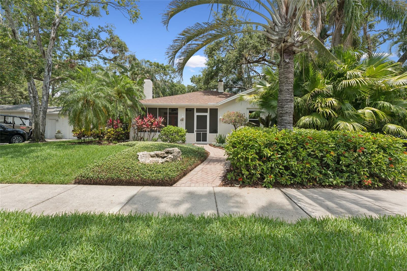 Welcome to Dunedin, the gem of the Gulf Coast! Don't miss this opportunity to live in Dunedin’s most exclusive neighborhood, in this delightfully updated 3 bedroom, 2 bath historic home on desirable Aberdeen Street. Enter this meticulously landscaped home through its screened lanai and be transported to Old Florida beauty. The lanai is the perfect place to sip a beverage while chatting with neighbors. French double doors lead you into the cozy living room with original parquet flooring and tons of natural light. Pass the stunning fireplace and head to the breakfast nook and refreshed kitchen. More natural light pours through the skylight and bounces off of the new quartz counters. Take in the perfect blending of timeless architectural charm with modern luxury as you stroll through the home which includes the addition of a primary suite with a walk in closet. This property is not only a sanctuary but it also offers peace of mind with its hurricane-resistant impact windows (2018) and a brand-new roof (2025). Other major system updates include two A/C units (2020 & 2024) and a new hot water heater (2024). The perfect Florida retreat, relax in the lush backyard that offers privacy and plenty of room for a pool oasis or stroll to the end of the street and watch the evening sunset on the water off beautiful Edgewater Drive. Ride your bike down the Pinellas Trail to the award winning Honeymoon Island or Clearwater Beach. Jump into your golf cart, walk if you prefer, and cruise to the quaint Downtown Dunedin lined with shops, restaurants and Florida’s premier micro-breweries. There’s a new festival or market most weekends. With all that Dunedin has to offer, make this exceptional property in one of Florida's most coveted neighborhoods your own, today! Buyer premium, preferred lender offering $5,000 towards rate buy down or closing costs if desired. Inquire with your agent for details.