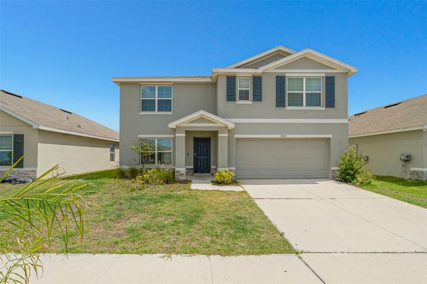 Welcome to this stunning 2023 built home in the highly sought after Berry Bay community of Wimauma! This spacious two-story residence with 5 bedrooms, 3.5 bathrooms, and over 2,600 square feet of thoughtfully designed living space.

The open concept floor plan features a bright and airy great room, seamlessly connecting to the modern kitchen equipped with granite countertops, stainless steel appliances, and ample cabinetry, perfect for both everyday living and entertaining. Durable ceramic tile flooring enhances the main living areas, while plush carpeting adds comfort to the bedrooms.

Upstairs, the generous primary suite provides a relaxing retreat with a large walk-in closet and en-suite bath. Additional bedrooms bring flexibility for guests, a home office, or growing households.

Constructed with all concrete block on both levels for added durability and energy efficiency, this home also includes smart home technology, central HVAC, and a 2-car garage.

Situated on a 6,000 sq ft lot, residents enjoy access to community amenities including a clubhouse, resort style pool, and playground. Conveniently located near US-301 and I-75, giving easy access to Tampa, St. Petersburg, and Sarasota.

Don’t miss the opportunity to own a nearly new home in one of Wimauma’s fastest-growing communities!