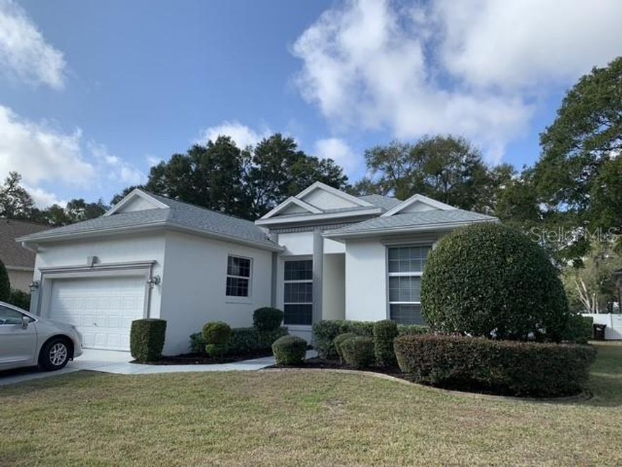 Roof replaced Jan 2024, HVAC original (Trane) on a twice yearly maintenance plan.  The best way to describe this well maintained home?  Its in the details!  First time on the market, fully furnished,  2 bedrooms, plus den, 2 baths, big kitchen with additional butlers pantry built in what would have been the laundry room.   Awesome large lanai for entertaining and enjoying FL weather, with beautiful view of the 14th hole.  12 ft ceilings, coffered in dining room, curved walls, eyebrow windows in living room and master bedroom (Upgrade).  Master offers additional flex space currently used for crafting.  Wood cabinets in kitchen.  Porcelain tile flooring throughout main living areas was installed with laminate laid first to keep tiles from cracking.  Additional storage in garage along with attic access.  Built in queen size murphy bed in the den offers additional sleeping space needed.  Located in Eagles Point,  Oak Run is highly sought 55+ community in Ocala FL.  The amenities are second to none, offering 6 pools (1 heated) 3 club houses, 18 hole golf course, restaurant, over 100+ clubs to join.  Plenty of outdoor activities to enjoy in Ocala plus the World Equestrian Center is only a 15 minute drive.  Central FL is the place to be!  Professional photos will be available to view later this week.