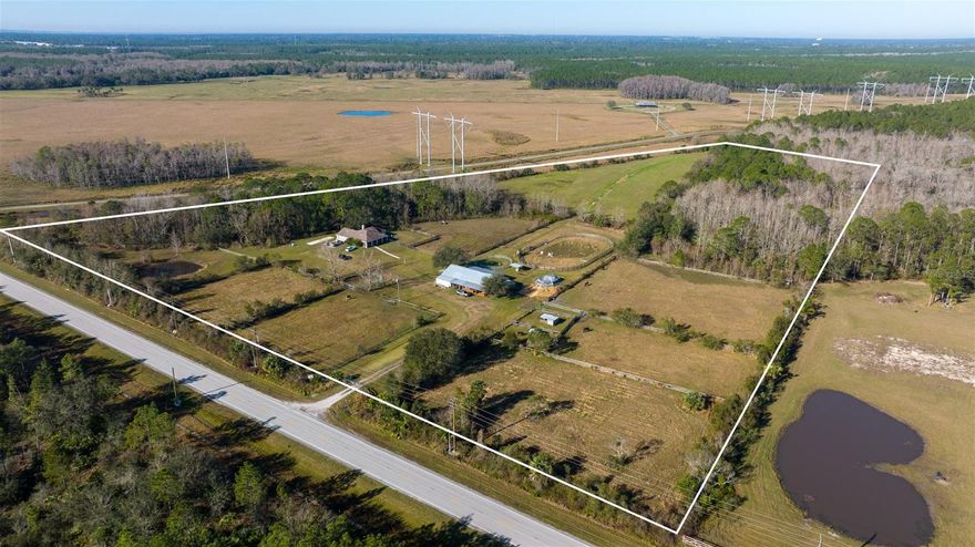 Welcome to a stunning 24-acre Dream property with a spacious single-family home that is perfect for entertaining family and friends.  The home boasts 3 bedrooms, 2 bathrooms, and a 2-car garage. The interior features a large living room with vaulted ceilings, wood burning fireplace, an open floor plan with living/dining room combination, and kitchen with plenty of counter space with bar and ample storage. The bedrooms are generously sized and the Primary suite includes an ensuite bathroom with double sinks and dual closets. The home has a large screened and covered patio that is great for outdoor entertaining and spectacular sunsets with a fenced backyard, perfect for your pets. It is surrounded by lush landscaping and mature trees, providing a serene and private setting.

This picturesque property is situated in a TERRIFIC LOCATION, close to schools, shopping centers, restaurants and airports. New Smyrna’s white sand beaches are just minutes away, making it the perfect spot to enjoy the Florida Lifestyle.

All information contained herein deemed to be accurate but to be verified by purchaser.