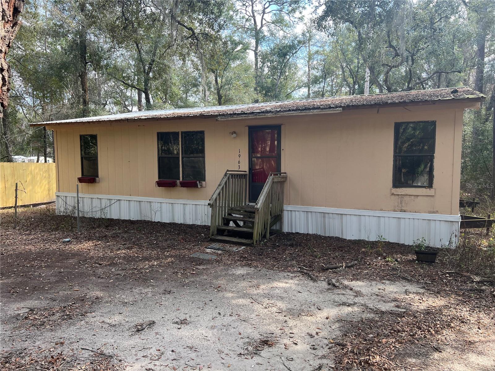 *HANDYMAN SPECIAL* This 3-bedroom, 2-bathroom 1,080 sq ft double wide manufactured home offers an excellent opportunity for those looking to invest in a property with immense potential. Located right on the serene shores of North Twin Lake, the home spans 1,080 square feet and sits nestled on 2.06 acres. Zoned Agricultural. Inside, you'll find a spacious layout, although some areas will require attention, as several floors are in need of repairs and the fridge/oven is not in place. The home features central heat and air for year-round comfort. Outside, a small storage shed conveys with the property, providing additional space for your tools or outdoor gear. The property also includes a durable metal roof, offering peace of mind for years to come. Whether you’re looking to renovate and make it your own or seeking a lakefront retreat to restore, this home is full of promise. Don't miss the chance to own a piece of waterfront property with endless potential. Schedule your tour today!