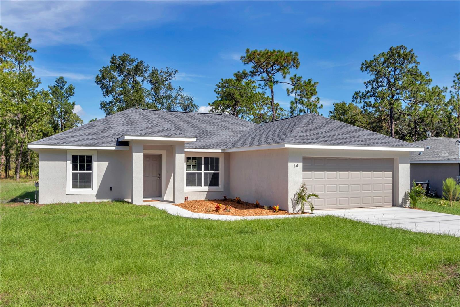 Move-in ready new construction on just under a quarter-acre lot in a growing Ocala neighborhood. This 3 bedroom, 2 bathroom home is a short drive to downtown Ocala and less than 10 minutes from Publix and Walmart. Inside you’ll find an open layout with soft-close shaker cabinets, granite countertops, and a full stainless steel appliance package, plus a washer and dryer for true turnkey living. The bathrooms feature fully tiled showers, and the master suite includes a private bath with a double vanity. Two additional bedrooms and a second full bath provide comfort and flexibility for guests or a home office. With quality finishes, modern design, and a convenient location, this home is an excellent choice for anyone seeking comfort and value in Ocala.