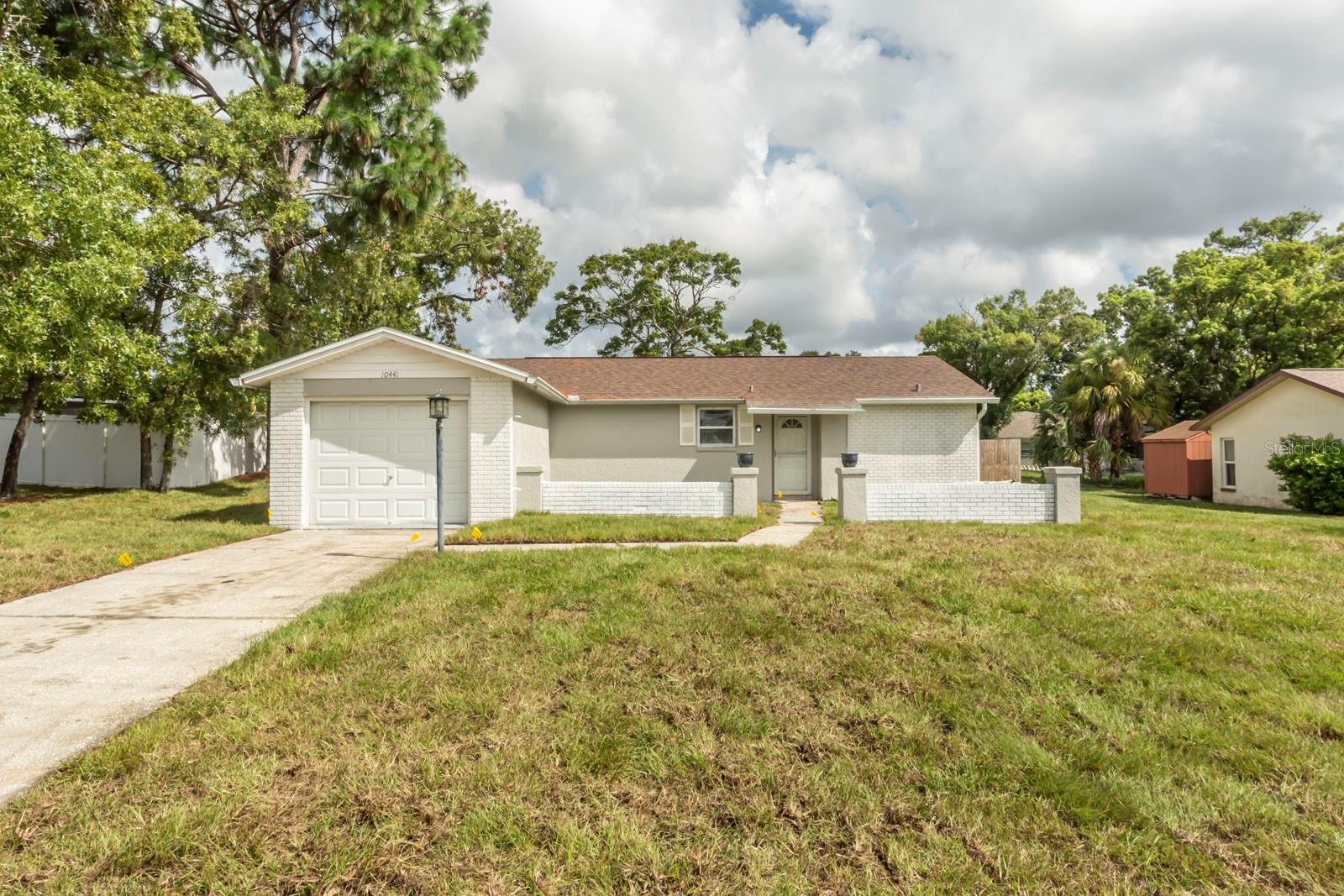 Check out this amazing updated 3 bed, 2 bath home that offers you a gorgeous kitchen, living/dining room combo, family room with a fireplace, split bedroom, screened in patio and a privacy fenced in back yard. The kitchen is completely redone, new quartz counter tops, new cabinetry, new appliances, even the kitchen sink is new! New luxury vinyl blank flooring throughout, new baseboards, new blinds, new vanities in the bathrooms, new light fixtures throughout, freshly painted interior and exterior, new sod, new 4 zone irrigation system. Home has been remediated engineering report available. Situated in a prime location, you'll find shopping, a hospital, and the Suncoast Parkway just moments away, with the stunning Hernando Beach and the enchanting Weeki Wachee Springs State Park right at your fingertips.