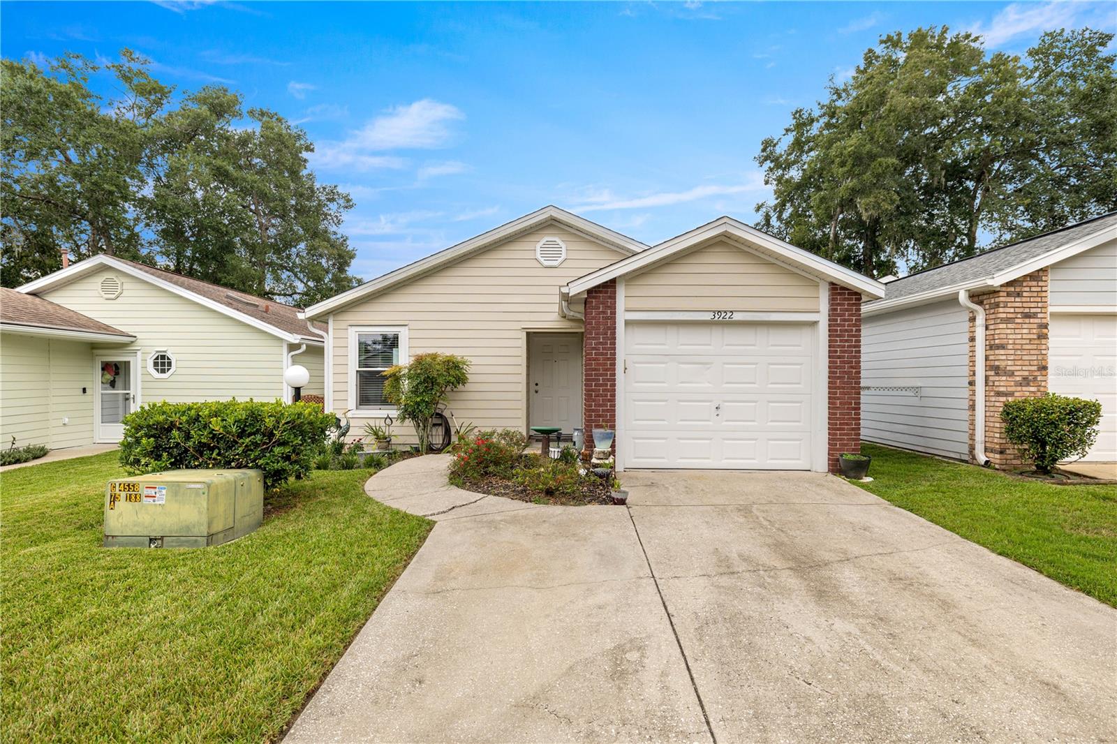 Move-in ready 3/2 with 1-car garage and one of the largest floor plans in the community! Across from the pool, this home shines with fresh paint, new flooring, updated light fixtures/ceiling fans, and all new appliances. French doors open to a screened lanai, while over $25K in upgraded heavy-duty white vinyl windows (2025) add lasting value. Bright and airy with blue coastal vibes throughout—your perfect Florida retreat!