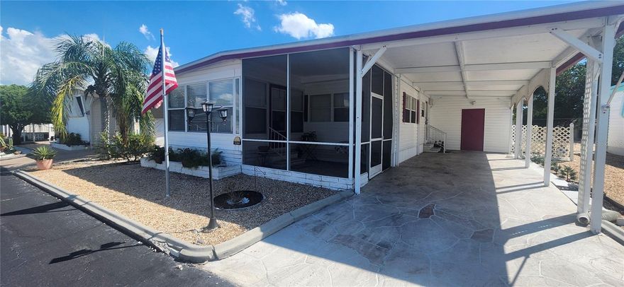 Very nicel well maintained 3 bed/2 bath doublewide with large air conditioned storage room (3rd bedroom option), shed, carport, utility room, in Tiki Village, a gated 55+ community where you own the land. NON-FLOOD ZONE with low $520/year HOA.   This home comes nicely furnished with window treatments, shades, built in cabinets and more.  Priced to sell.  Cheapest double wide in complex at time of listing.  No flooding occurred in this home or in Tiki Village during the Hurricanes as this community is high and dry.  Check out all the homes in Tiki Village to realize the great value and pricing for this home.