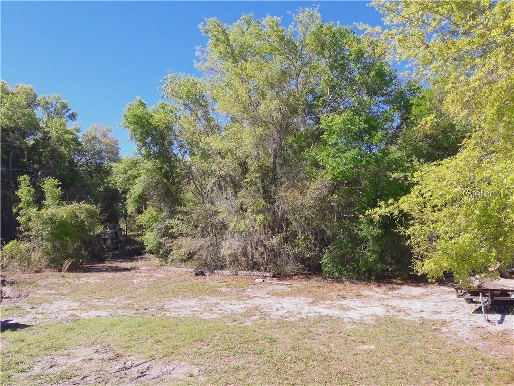Build your DREAM HOME on the water with almost an acre of land (.78 acres) and 200' of waterfront. Beautiful Lake Lowery, has a piece of paradise waiting for you. This land has lake access through a water channel on the backside of lot, great for pontoon boats, bass boats and jets skis. From the center of the property you will have water views in three different directions. Some of the land offers mature trees, while there is a grassy, sunny area too. This location gives the true feeling of "being away from it all" while only a few turns takes you to shopping, doctors, restaurants and entertainment. Electric, Septic and Well are available.