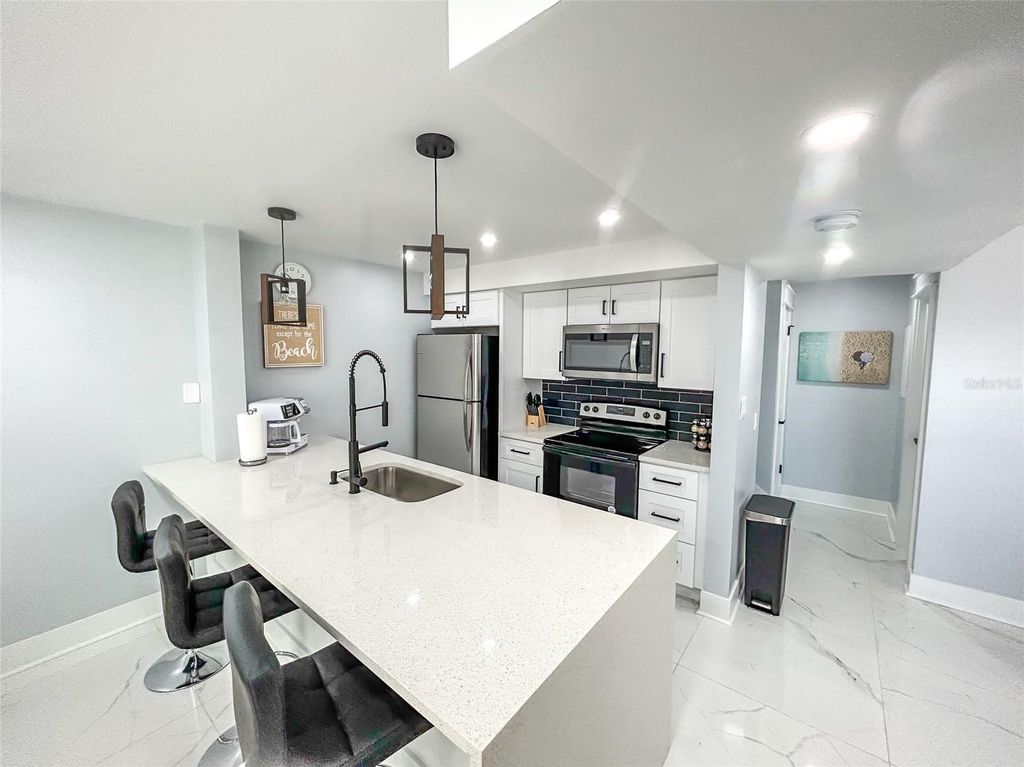 Photo of 315 Medallion Boulevard #F, Madeira Beach, FL 33708 (MLS # O6335780)