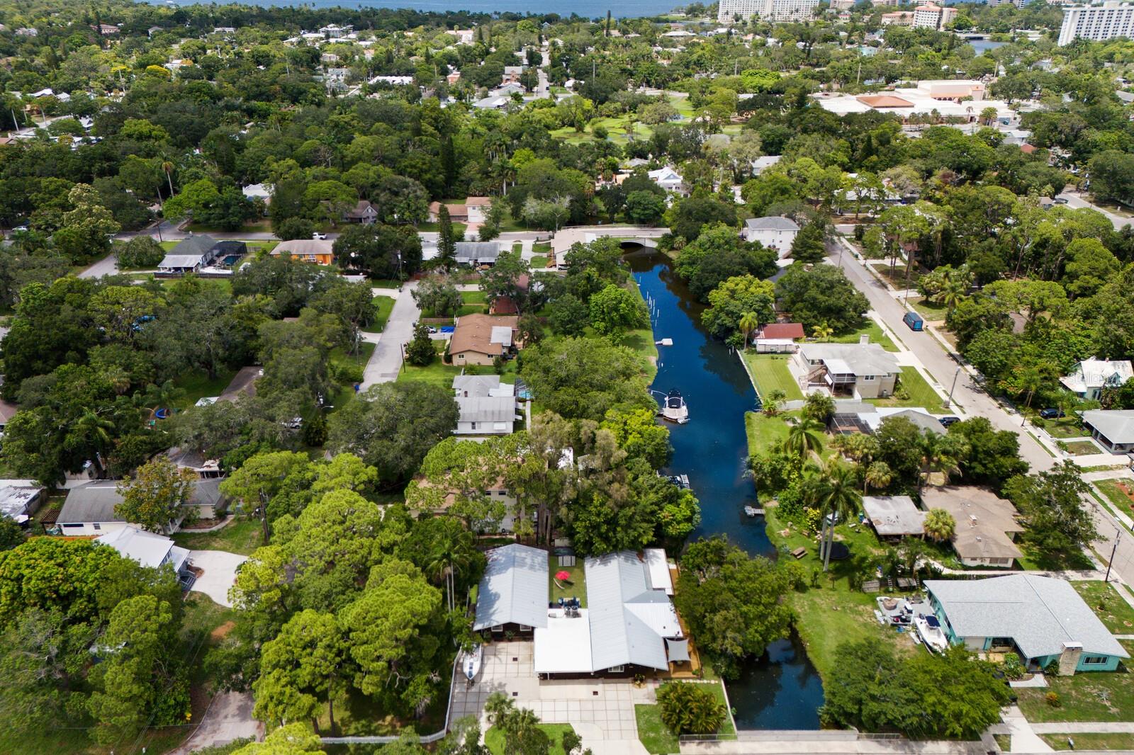 Looking for a WATERFRONT INCOME property with 2 UNITS ? This two-family home in Wares Creek, Bradenton, FL, features two separate living units, each with two bedrooms and two baths. This property is highly desirable for both investors and owner-occupants looking to offset their mortgage with rental income. A classic Florida-style featuring cedar wood exteriors, with a touch of old Florida charm. Surrounding the waterfront property, you will find mature landscaping with native plants, palm trees, and a well-maintained lawn. Ample parking for both units including a garage for the main home. Each unit has its own private outdoor entertainment area which provides tenants with a personal retreat. Each unit has its own entrance, ensuring privacy for tenants. The bedrooms are spacious with adequate closet space and large windows for natural light. The baths, feature modern fixtures, a combination of tub and shower, and tile flooring. Open concept living and dining areas in each unit, offering a comfortable and functional living space. Both units have a fully equipped kitchen, ample cabinet space, and countertops. In-unit laundry facilities in the main home and the attached property has a separate private laundry area. Separate meters for each unit, allowing tenants to pay for their own utilities, reducing the landlord’s expenses. Given its prime location, a four-bedroom, four-bath, two-family property in Wares Creek can attract steady tenants, offering a reliable source of rental income. The area’s proximity to downtown Bradenton, schools, parks, and local amenities further enhances its attractiveness to potential renters. Conveniently located near major roads, public transportation, and just a short drive to the beautiful beaches of Anna Maria Island. Close to local shops, restaurants, parks, and recreational facilities, making it a great place for families and professionals alike. Overall, a four-bedroom, two-family income-producing property in Wares Creek, Bradenton, FL, offers a blend of historical charm, modern conveniences, and strong rental potential, making it an excellent investment opportunity.