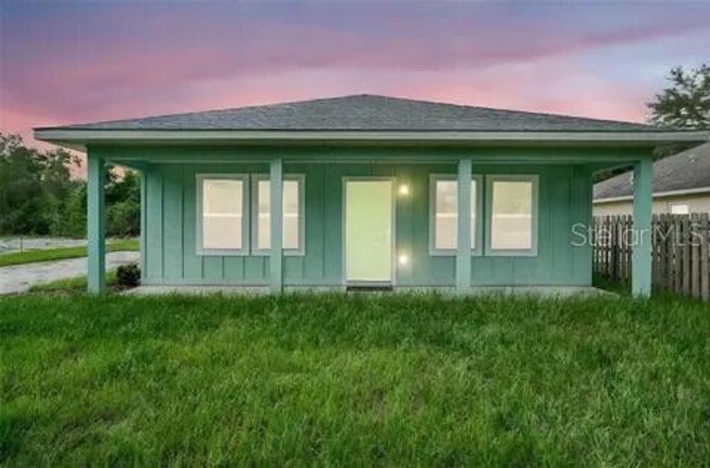 Photo of 40091 Oakridge Drive, Lady Lake, FL 32159 (MLS # O6389036)